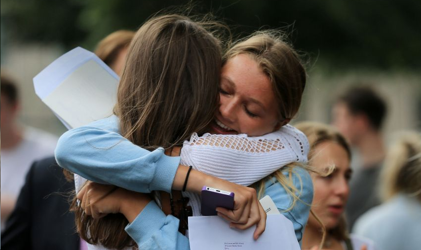 Martha North-Concar celebrates her A level results with a friend at Brighton College in East Sussex