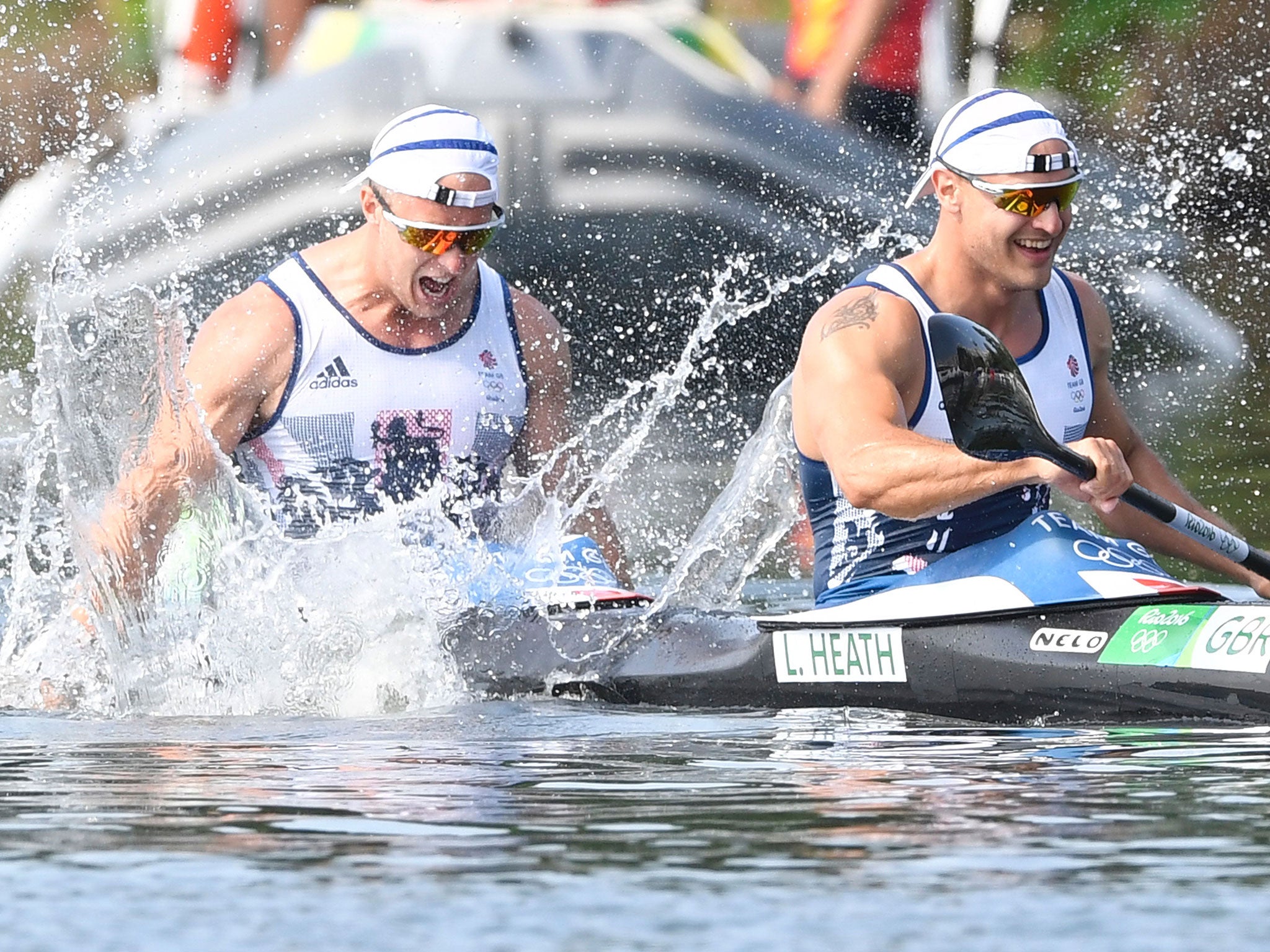 Liam Heath and Jon Schofield celebrate after crossing the finish line for silver