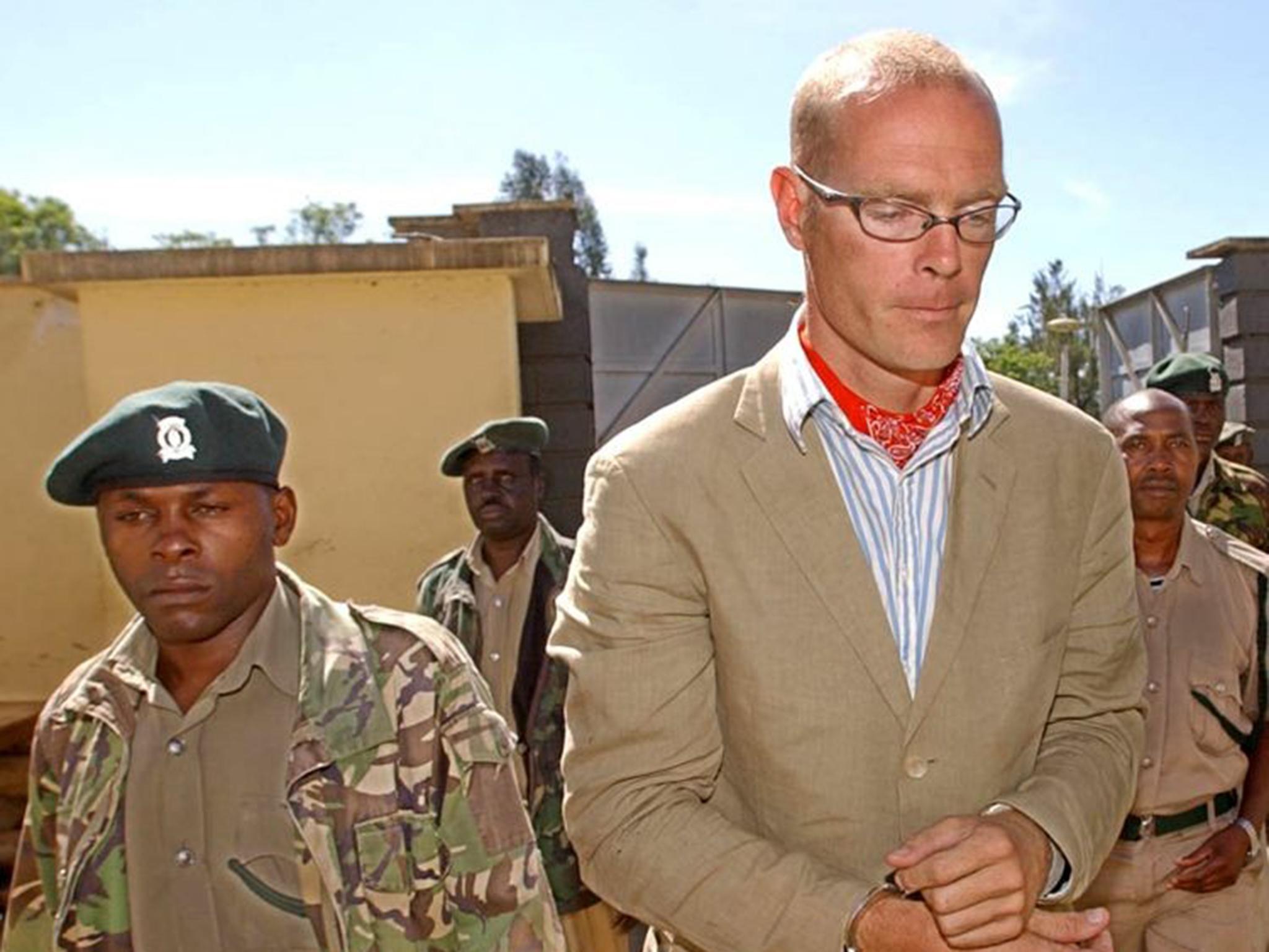 Cholmondeley being escorted to court in 2005