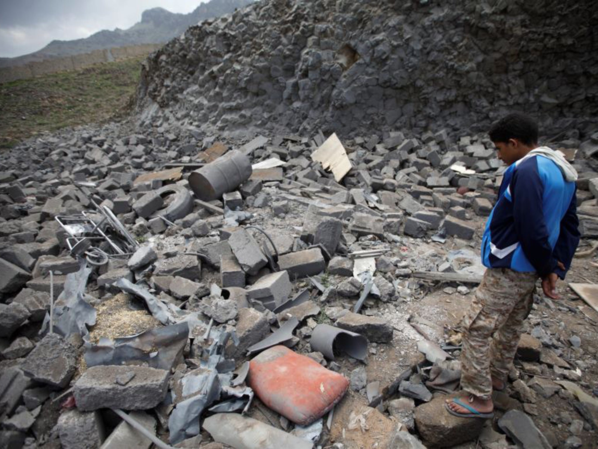 A man surveys the rubble of a house after it was destroyed by a Saudi-led air strike in Sanaa last week