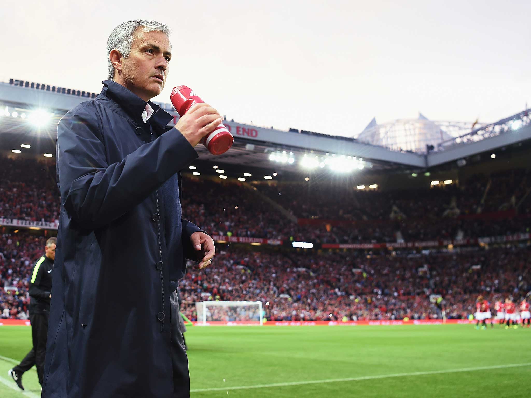 Jose Mourinho takes to his seat in the Old Trafford dug out for the first time