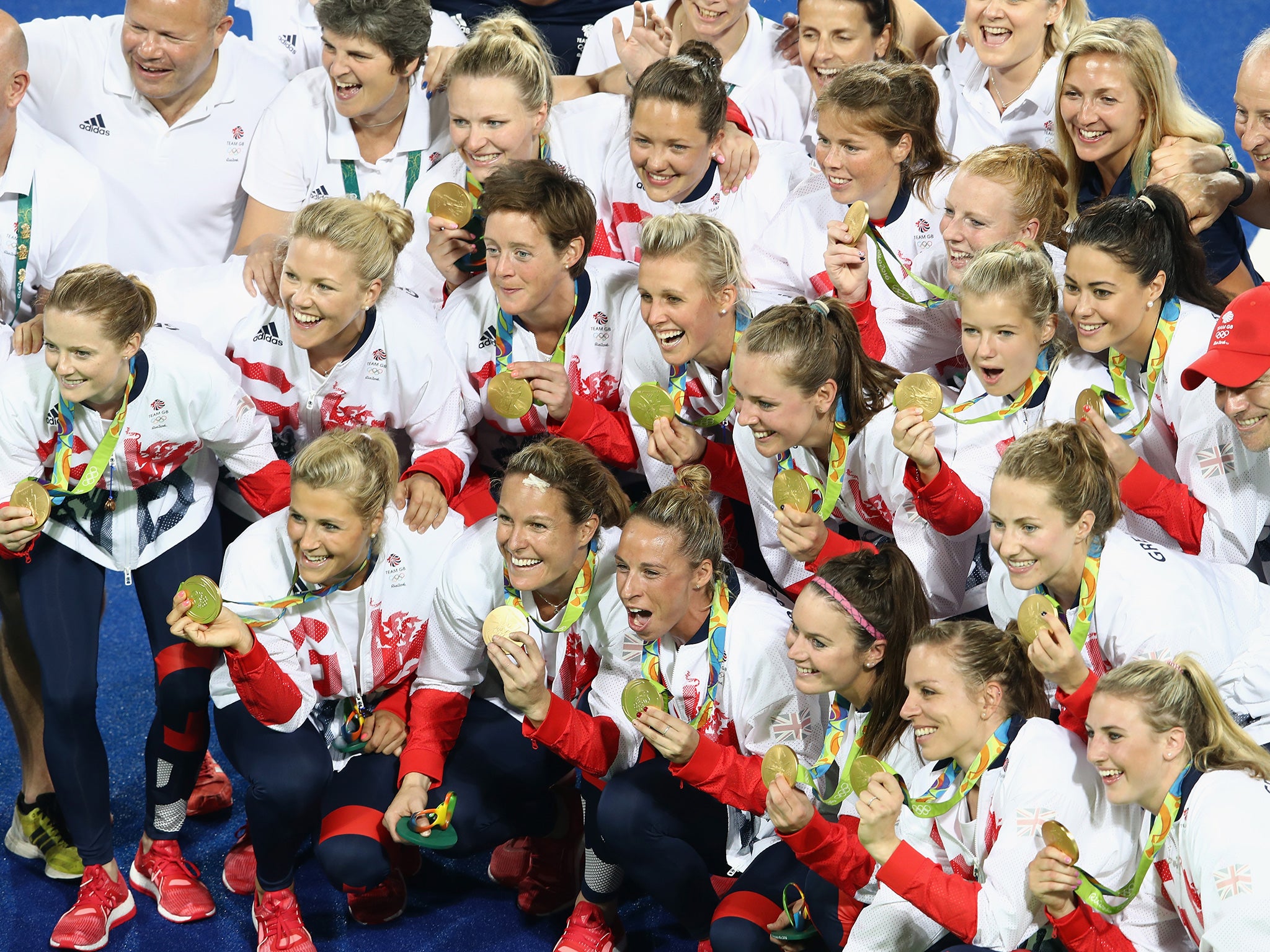 Team Great Britain pose with their gold medals after defeating the Netherlands
