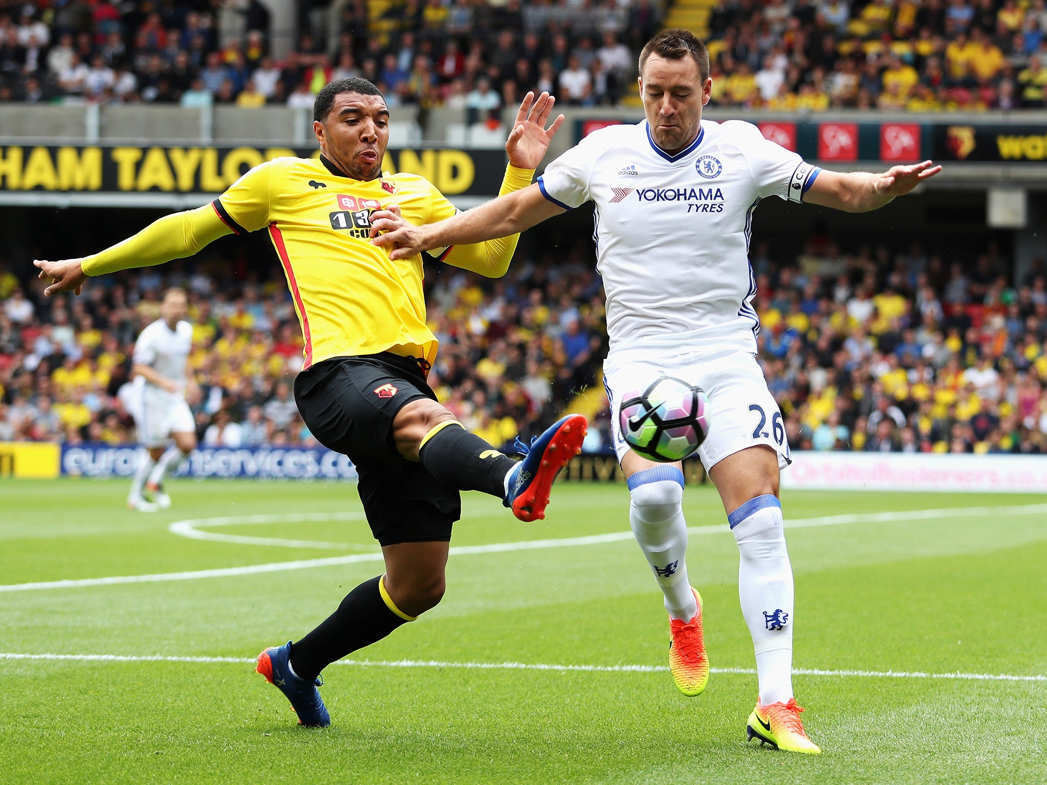 Deeny and Terry battle for possession at Vicarage Road