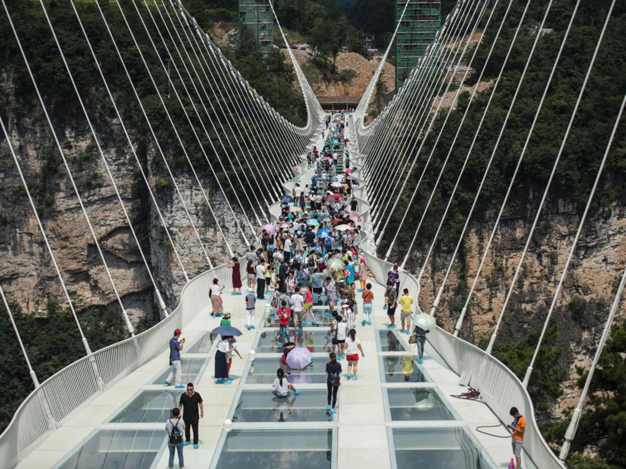 The world's highest and longest glass-bottomed bridge is seen above a valley in Zhangjiajie in China's Hunan Province