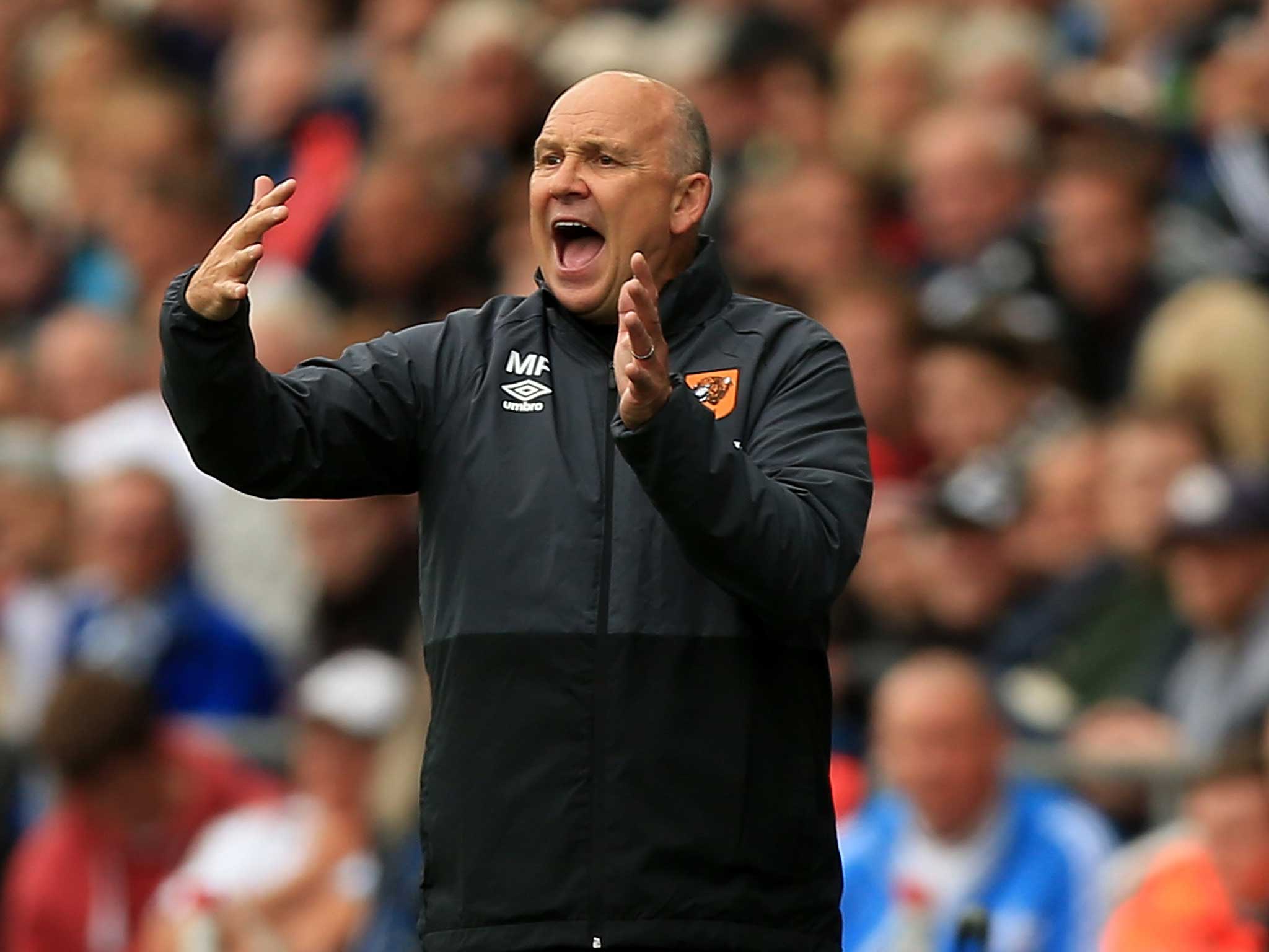 Mike Phelan orchestrates his Hull players at the Liberty Stadium