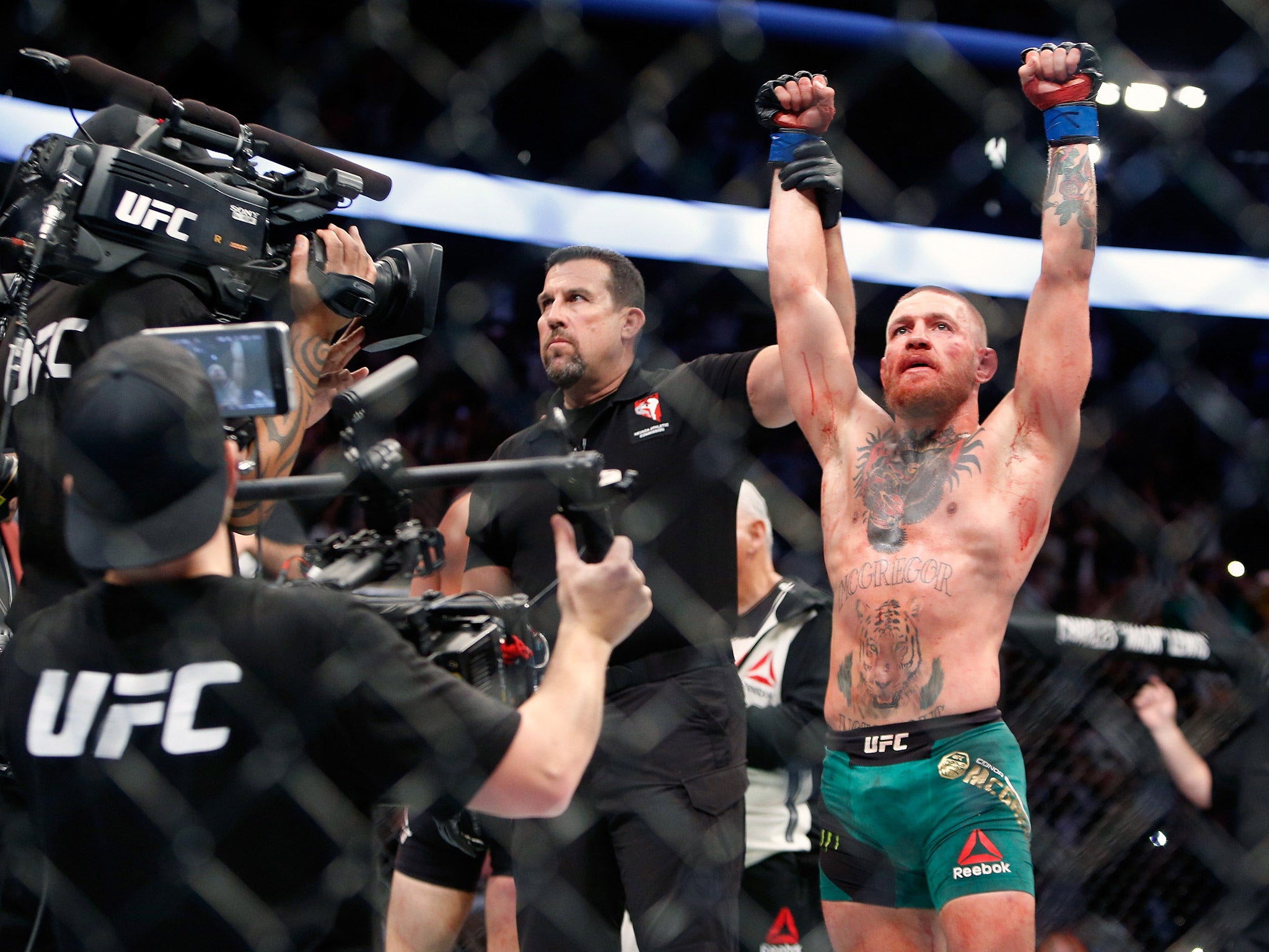 Conor McGregor celebrates his victory over Nate Diaz at UFC 202