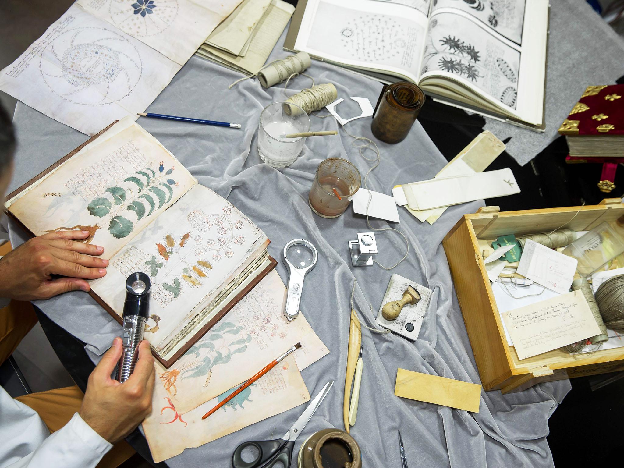 Quality control operator of the Spanish publishing outfit Siloe Luis Miguel works on cloning the illustrated codex hand-written manuscript Voynich in Burgos