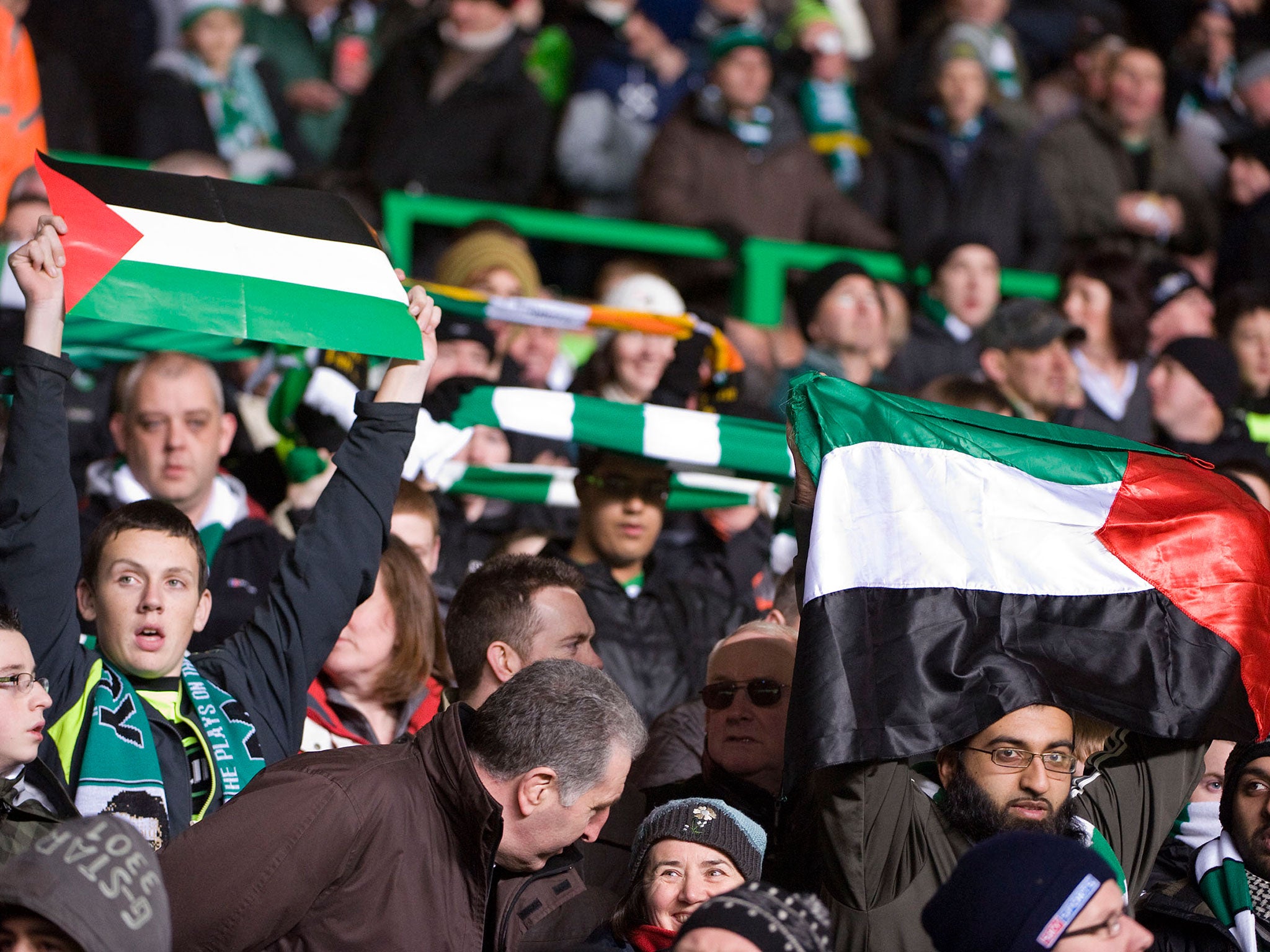 Fans with the Palestine flag