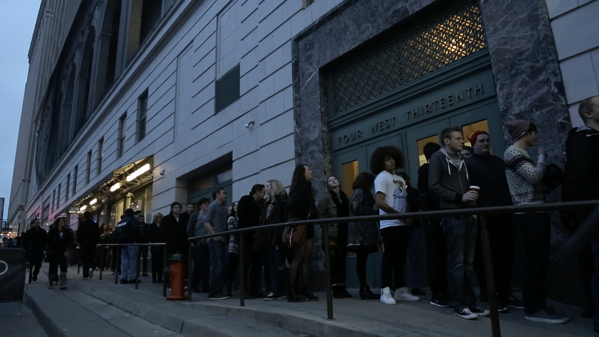 Fans wait to be let into a Glass Animals gig