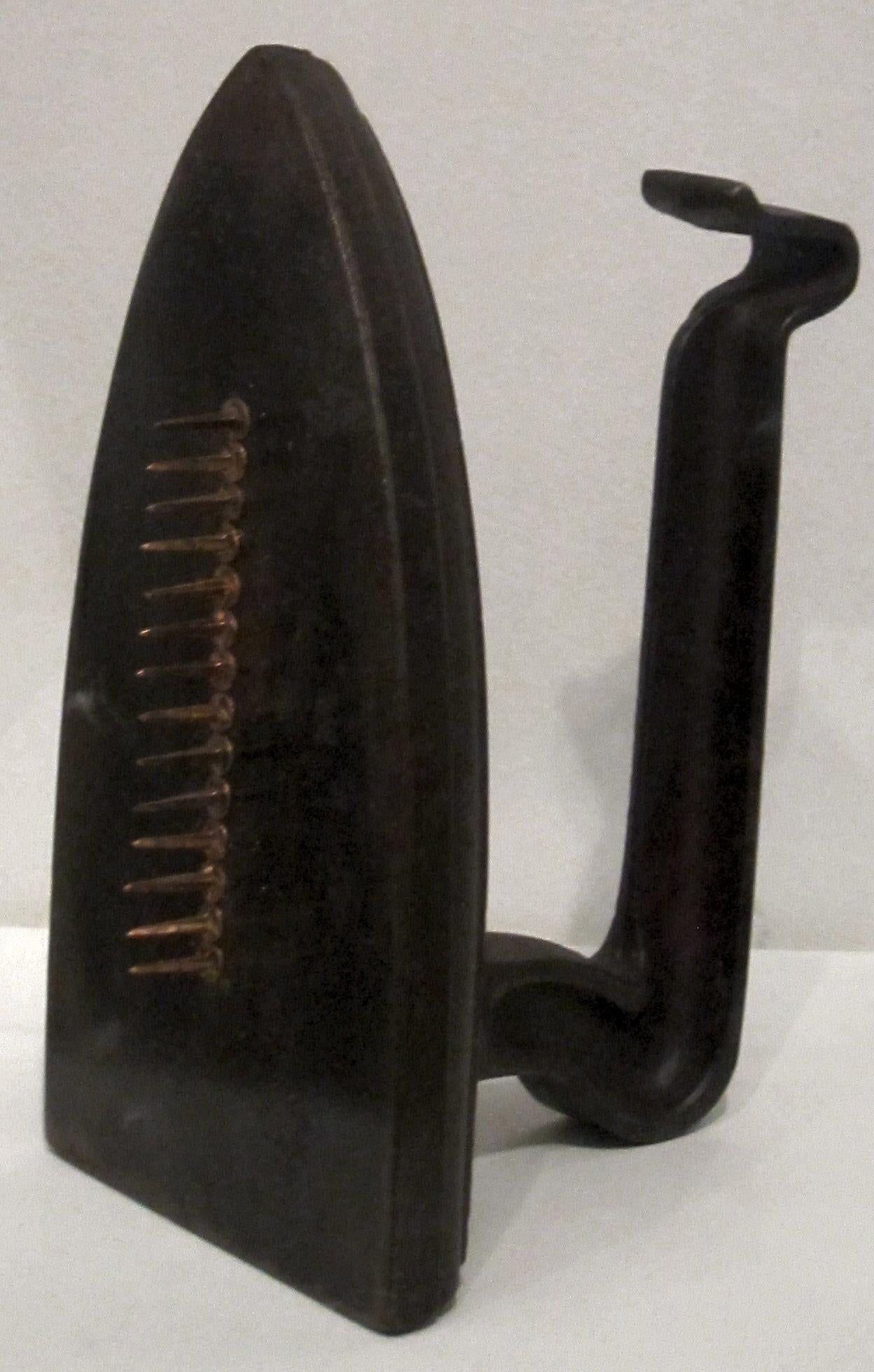 Cadeau sculpture by Man Ray, iron and nails, 1921, edited replica 1972, Tate Modern