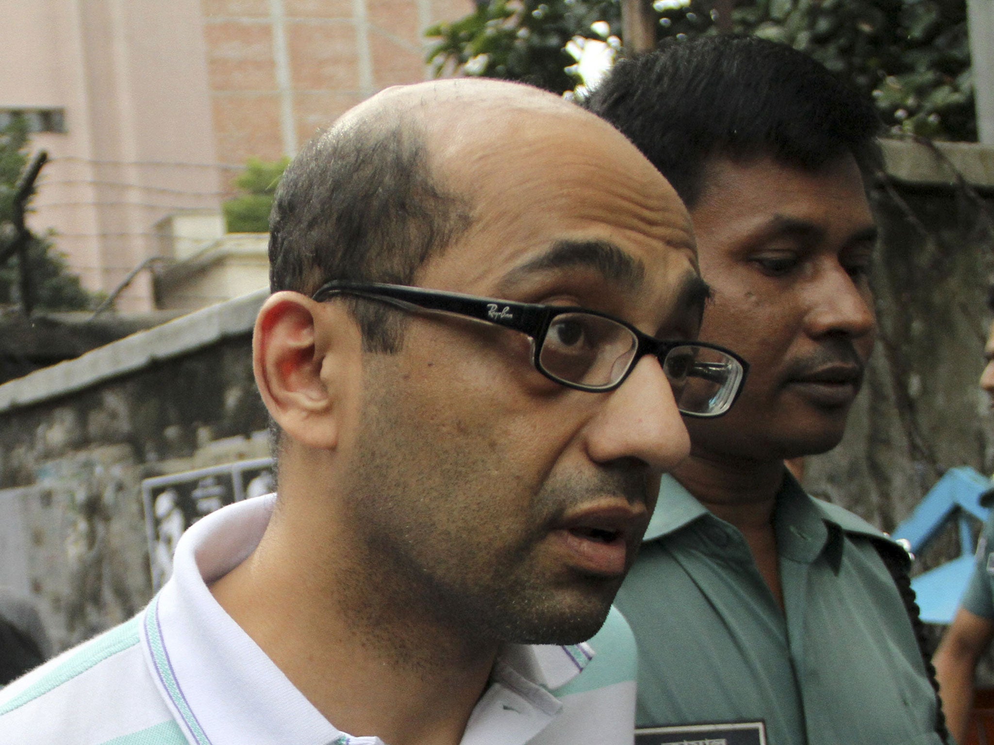 Hasnat Karim leaves after his court appearance in the Bangladesh capital Dhaka on 13 August 2016 (AFP/Getty)