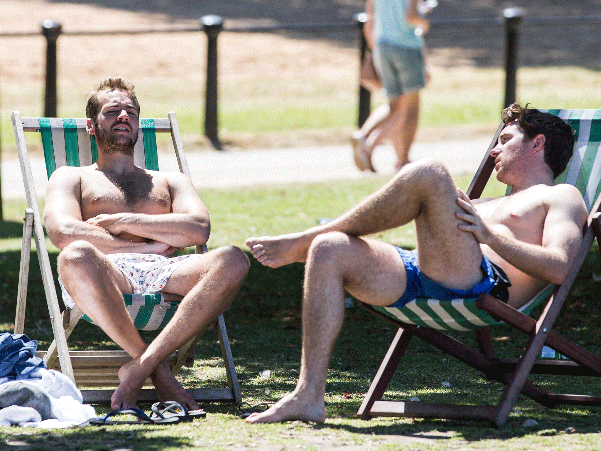 Men relax in the sun in Hyde Park in London. Temperatures in the capital are expected to hover around 30 C while Manchester will see mid- to low- 20s