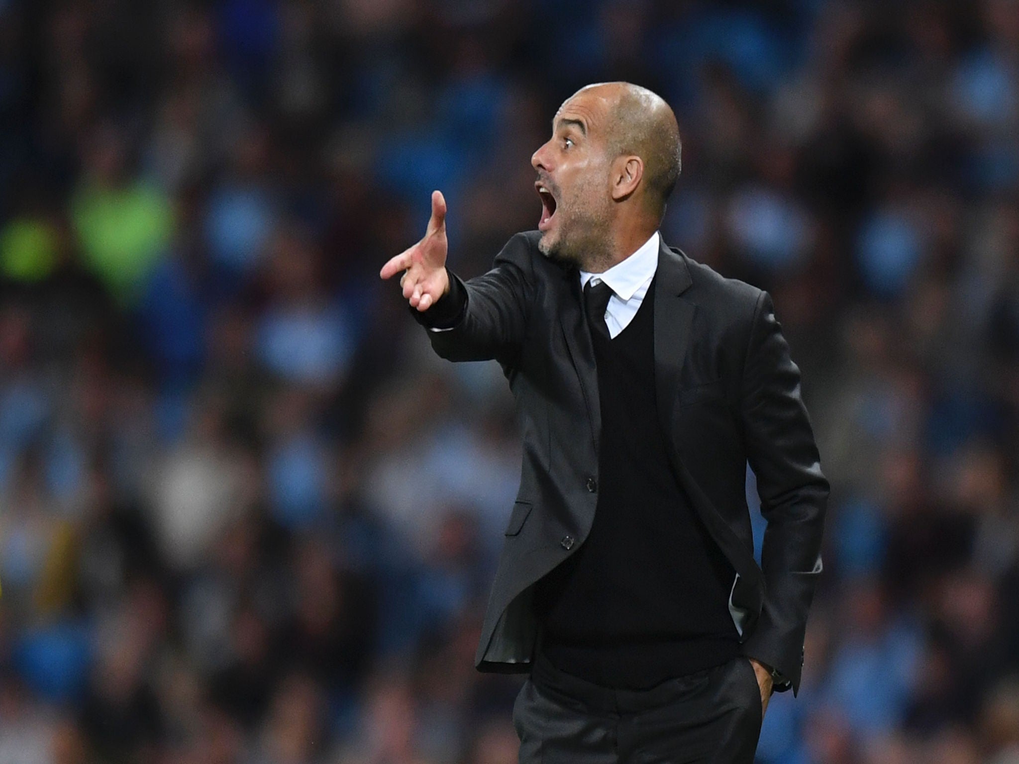 Pep Guardiola barks instructions from the side-lines