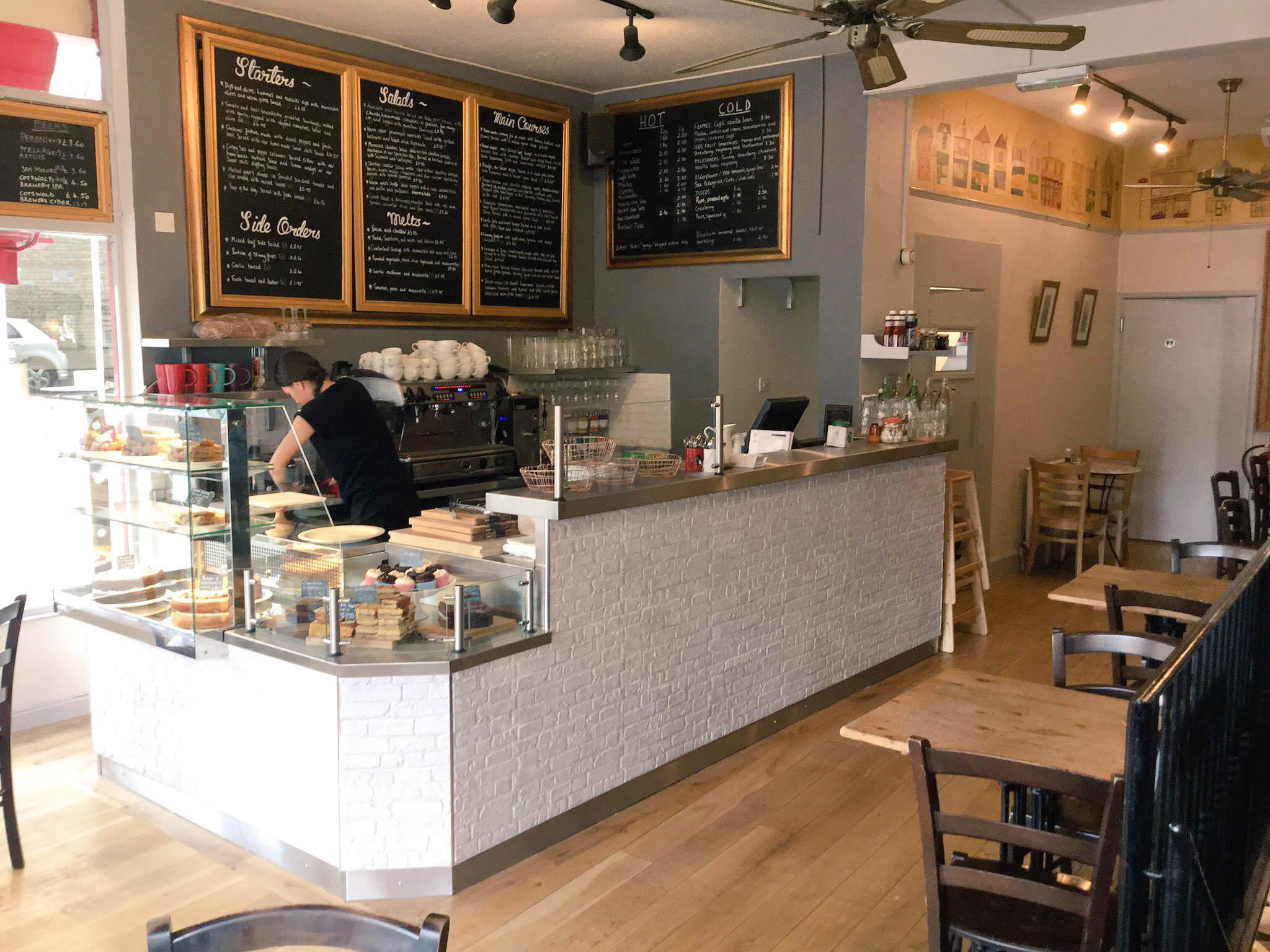 &#13;
The interior of The Jericho Cafe shows off the Barefoot Kitchen cakes (Ruth Dorso)&#13;