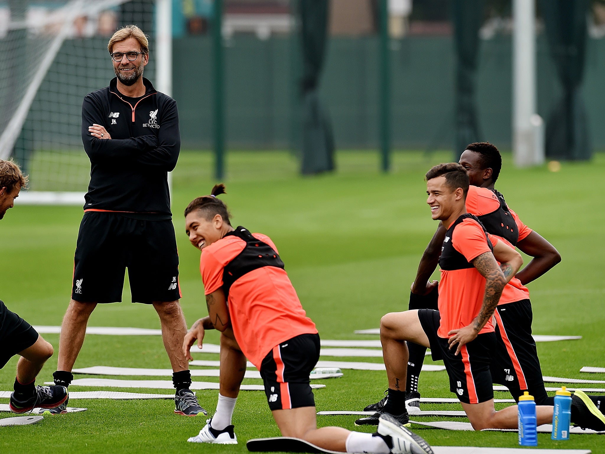 Klopp on the training ground with Roberto Firmino, Coutinho and Divock Origi