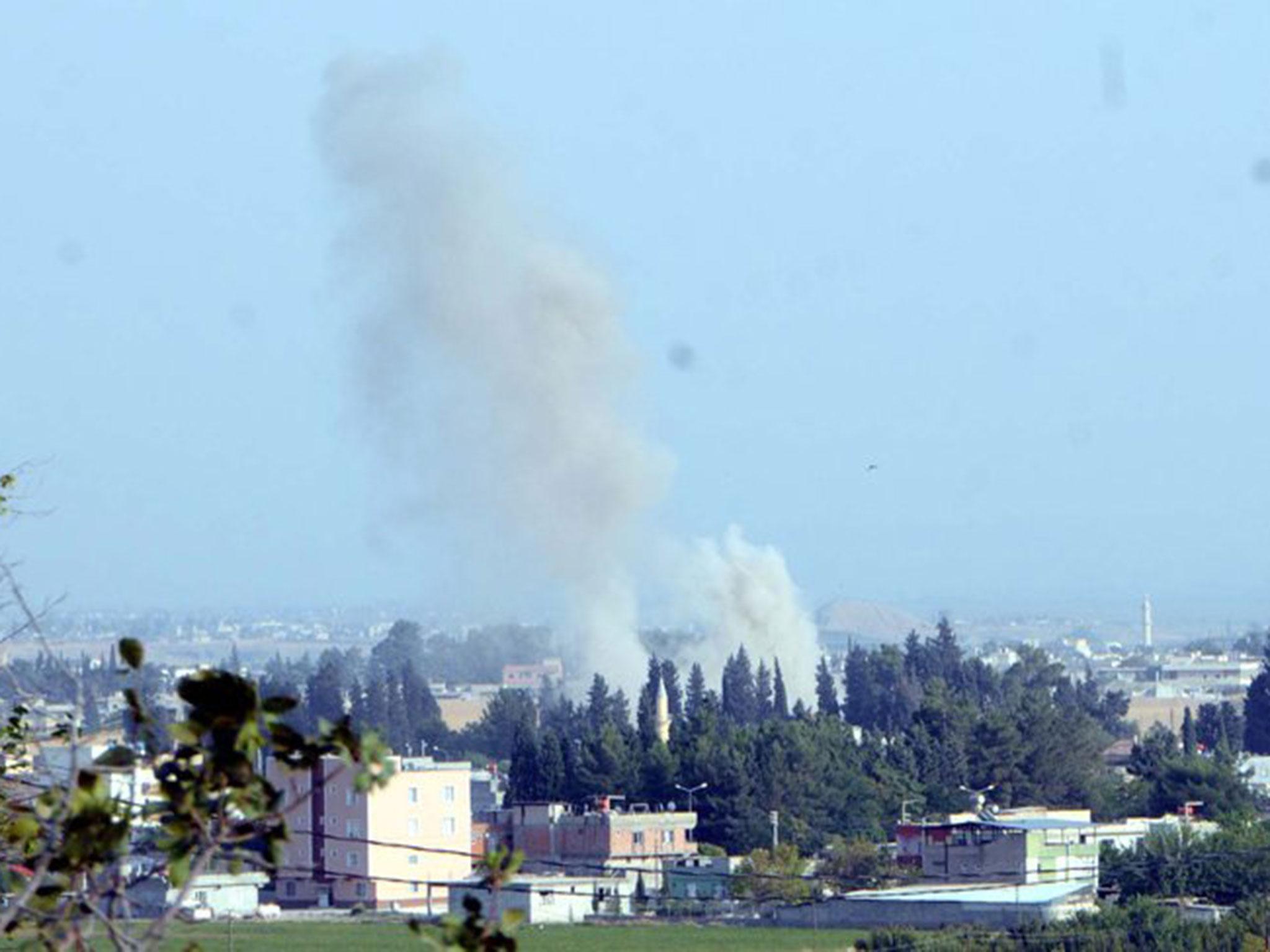 A photo released by operation Euphrates Shield showing air strikes on what it said was YPG positions south of Jarablus on 27 August