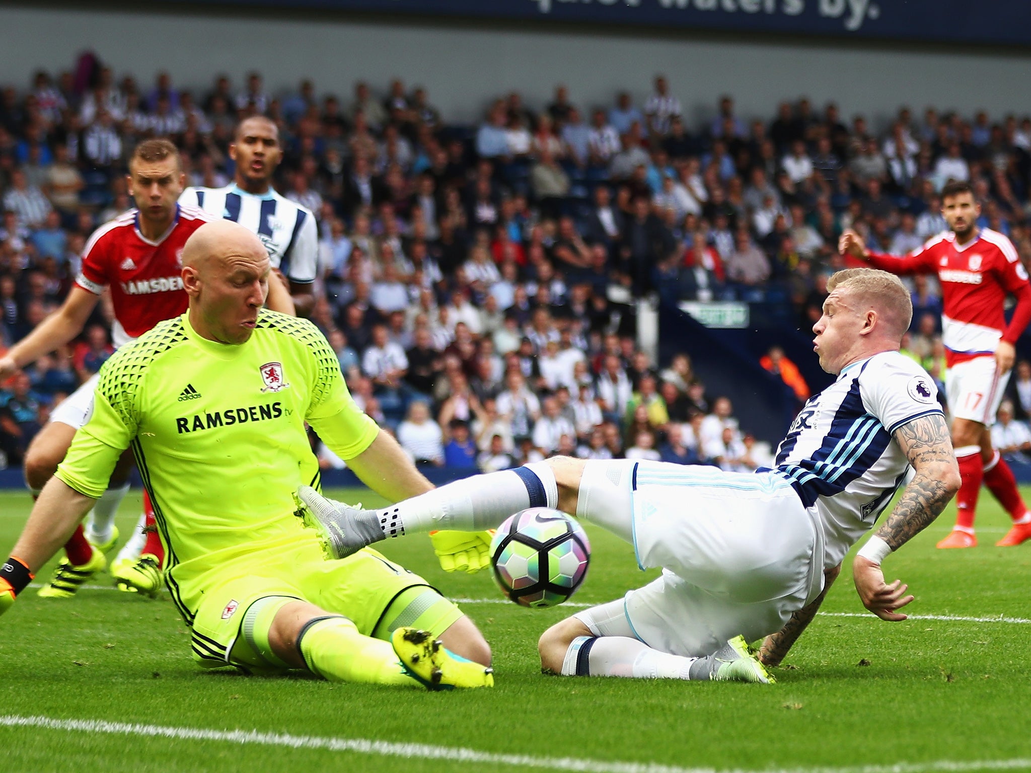 Guzan dives to block McClean's attempt on goal