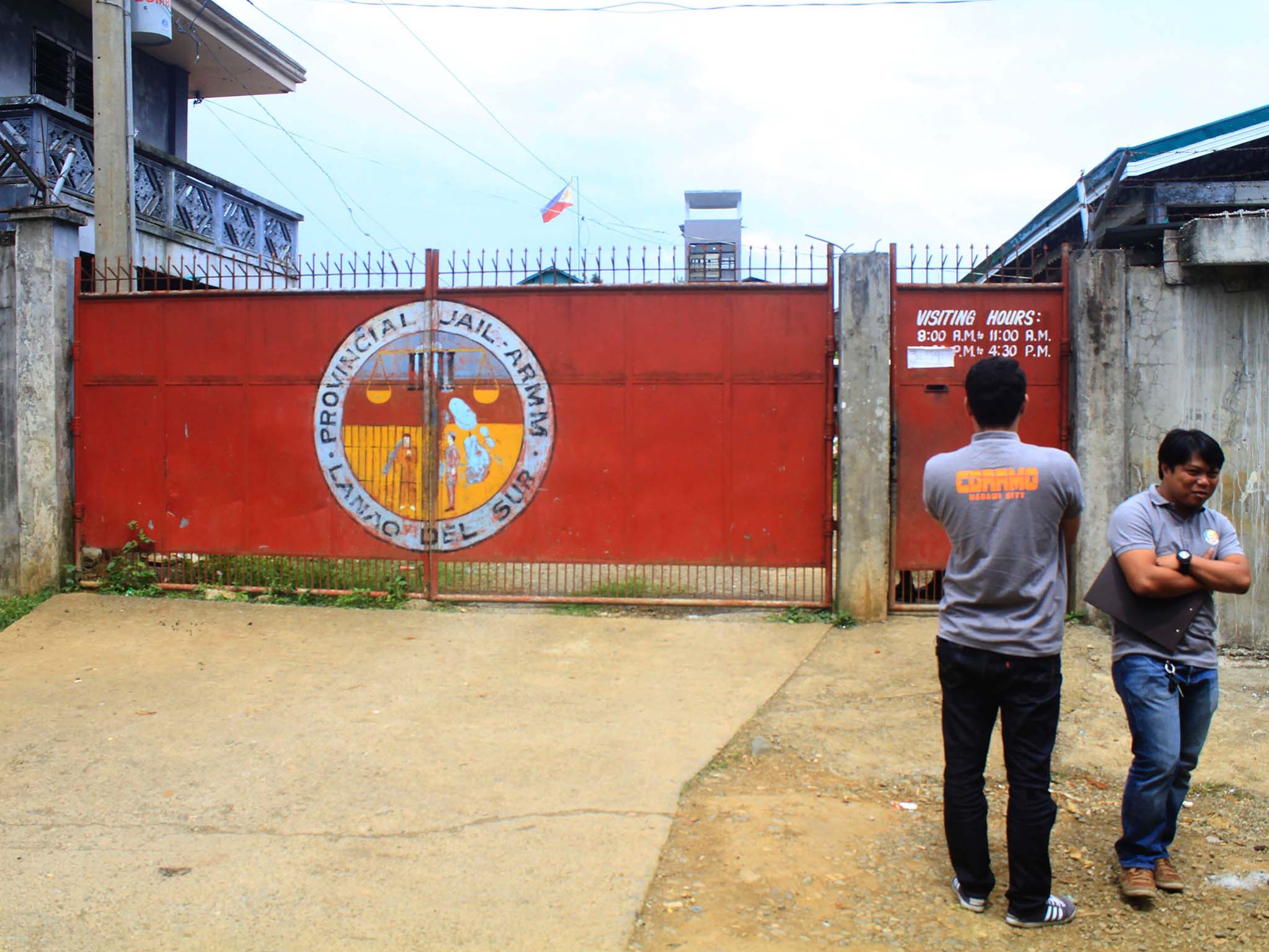 Local government officers at the gates of Provincial Jail in Marawi City on 28 August 2016, a day after members of Maute, a group of Muslim extremists inspired by the Islamic State movement, stormed in and rescued their jailed comrades