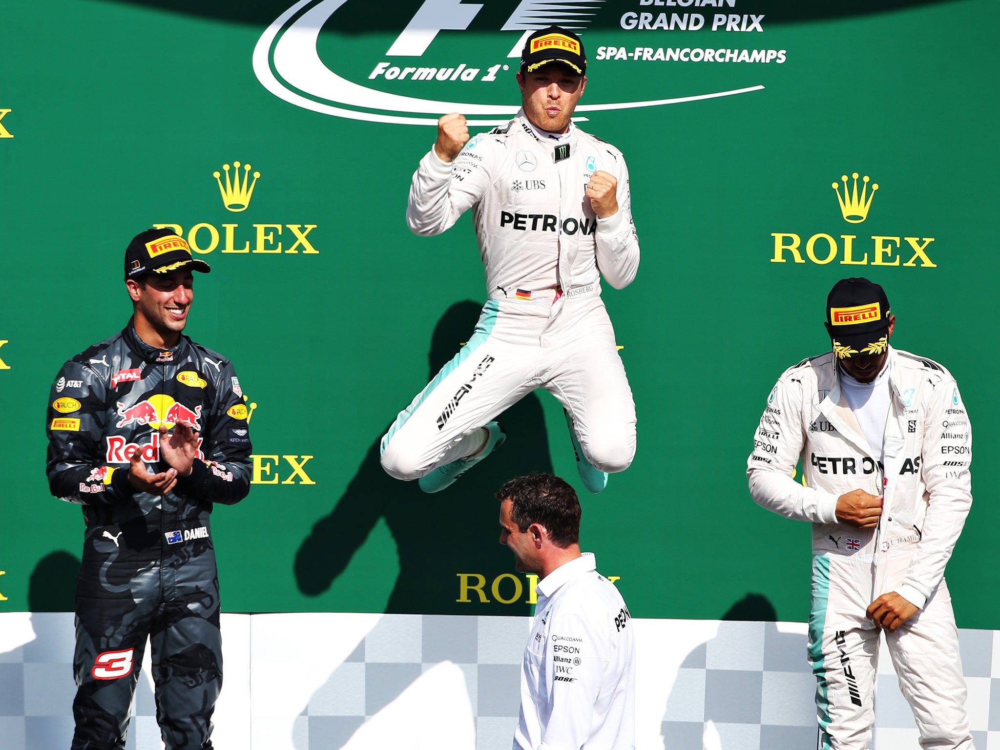 Rosberg celebrates his victory with Ricciardo and Hamilton on the podium