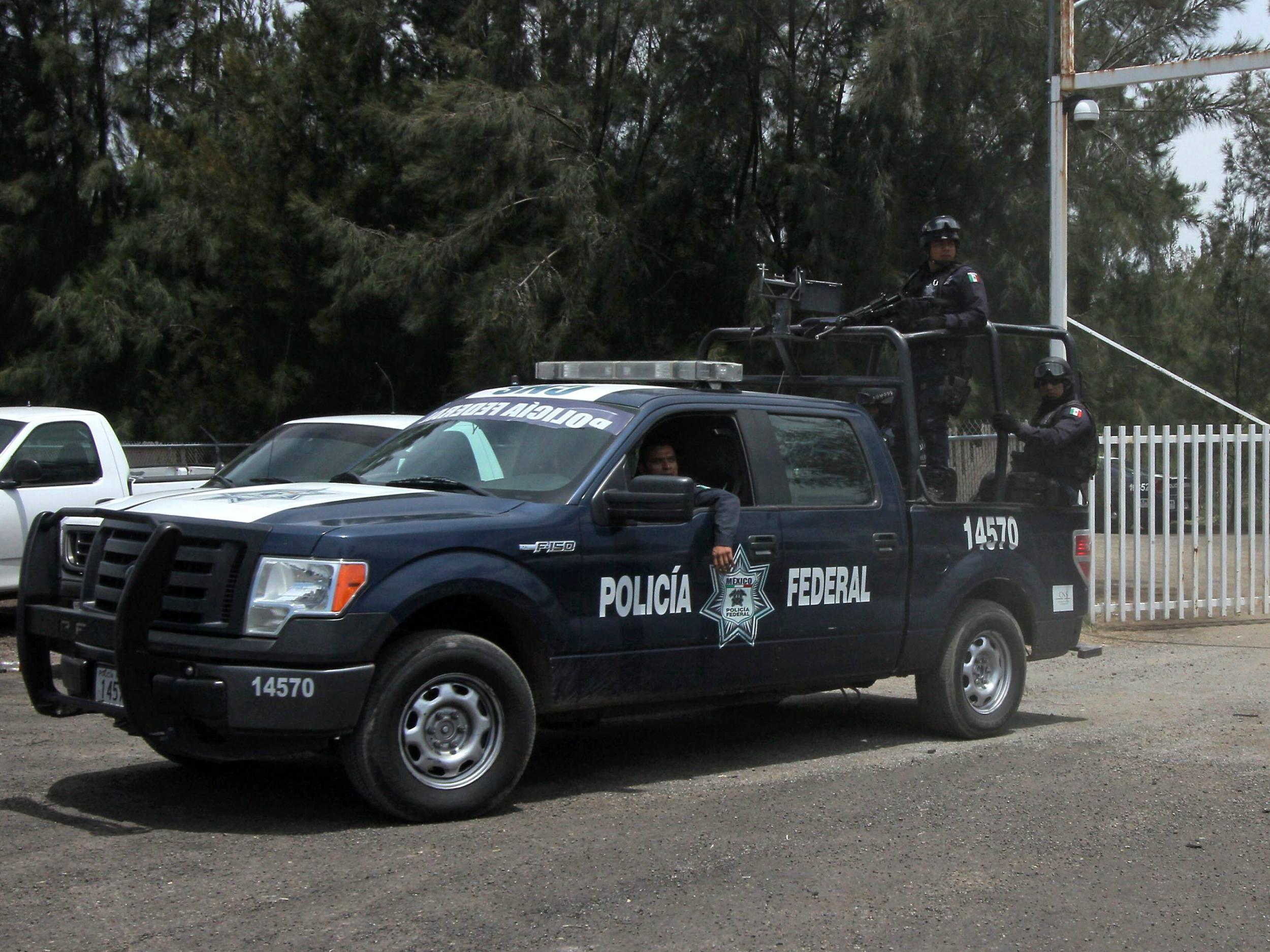 Mexican federal police outside the ranch where the alleged executions took place in May 2015 Hector Guerrero/Getty