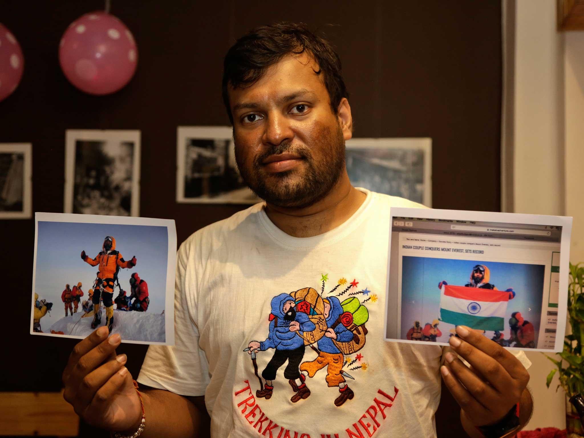 Climber Satyarup Sidhantha holds a photo of him at the summit of Everest, alongside what he claims is the altered version