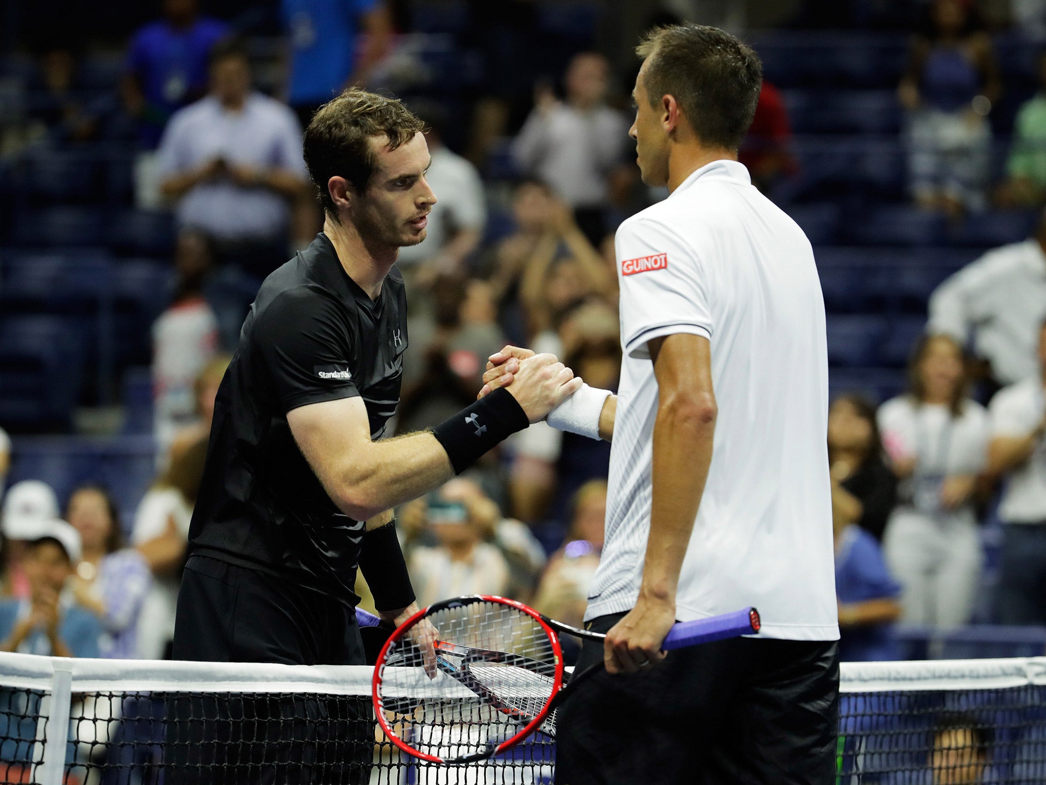 Murray shakes hands with Rosol after beating him in the US Open first round