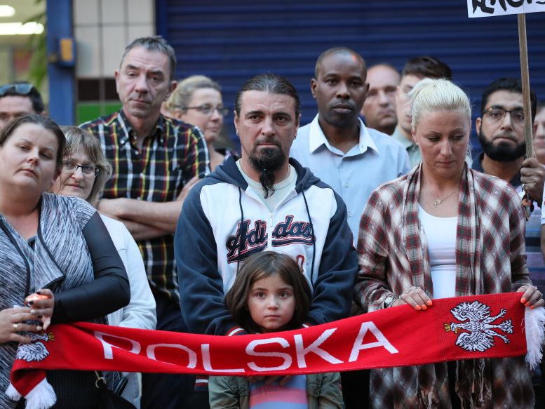 People attend a vigil in Harlow to pay tribute to Arkadiusz Jozwik