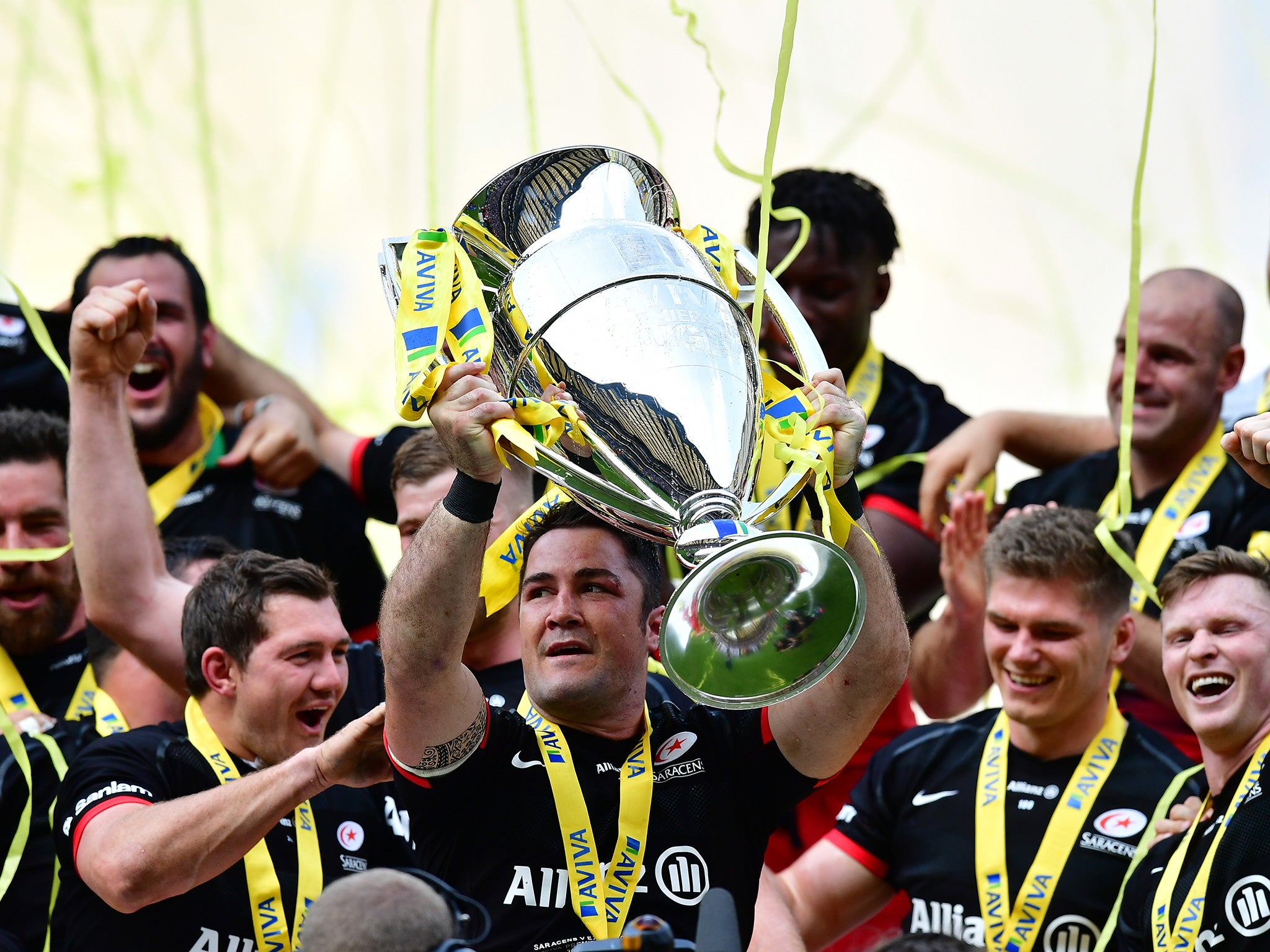 Brad Barritt of Saracens lifts the Aviva Premiership trophy