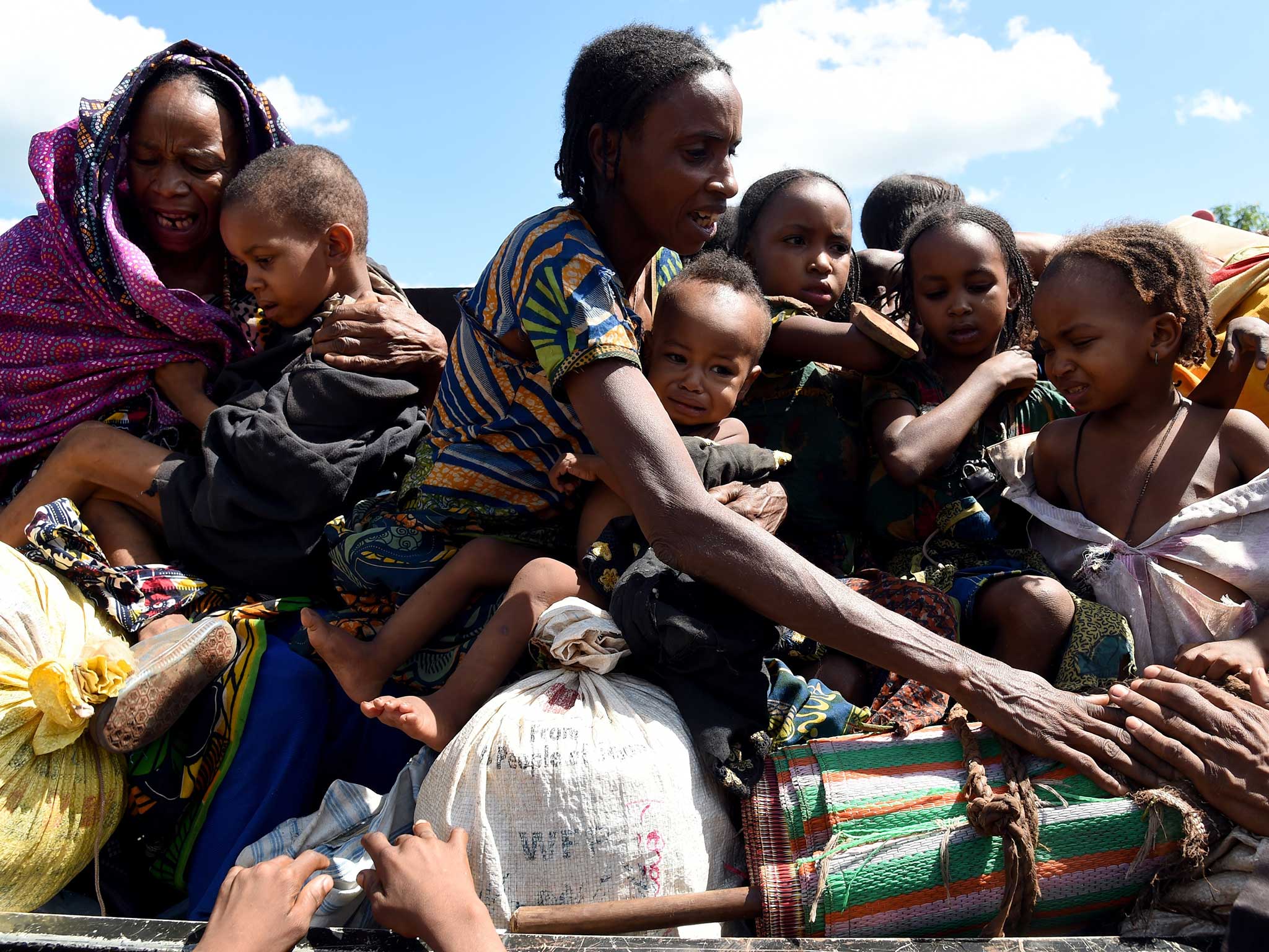 Pullo families wait after arriving at a centre for displaced muslims fleeing the anti-balaka militia, in Yaloke, some 200 km east of Bangui, on May 4, 2014