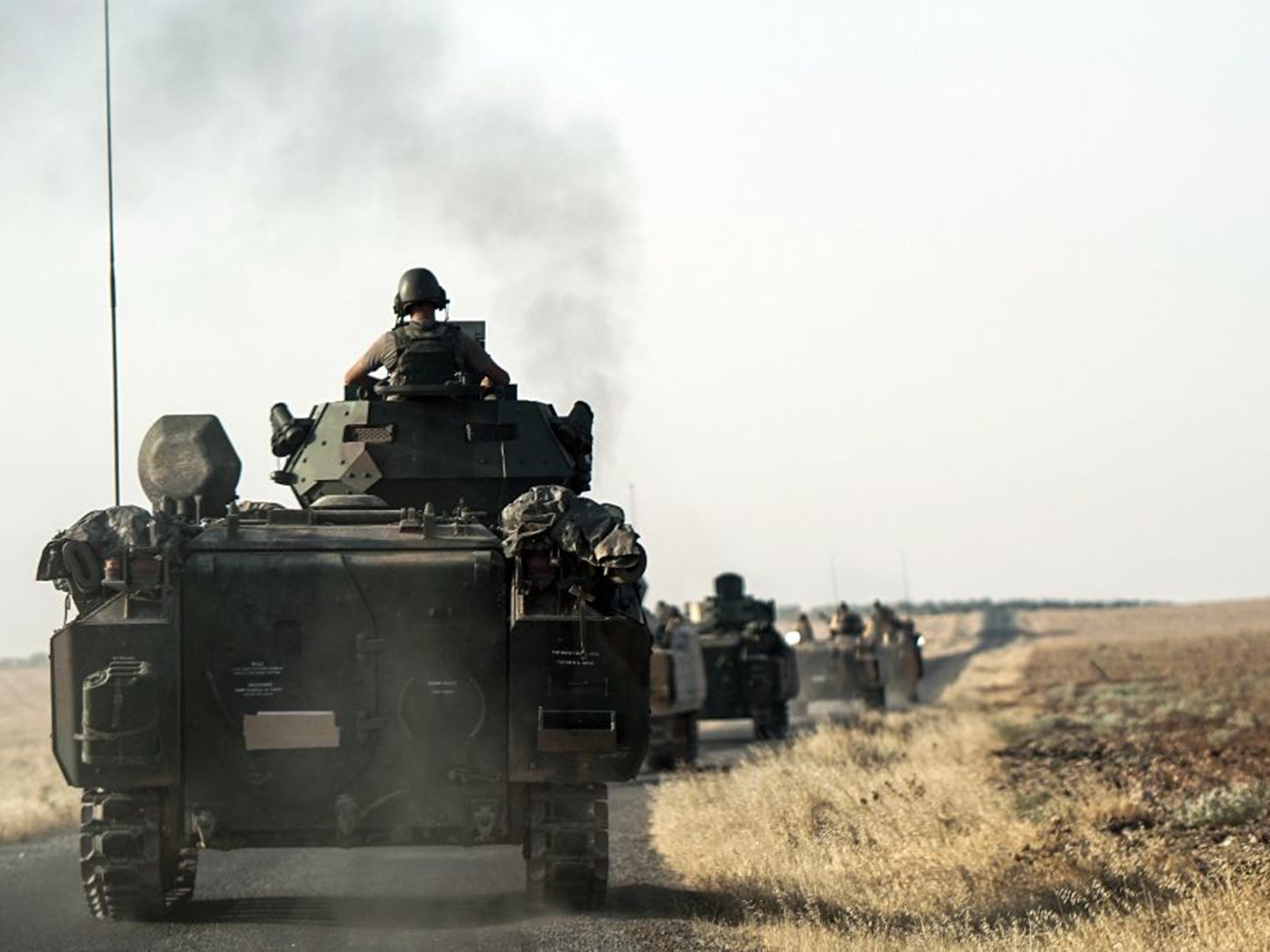 Turkish troops head to the Syrian border as part of the recent offensive