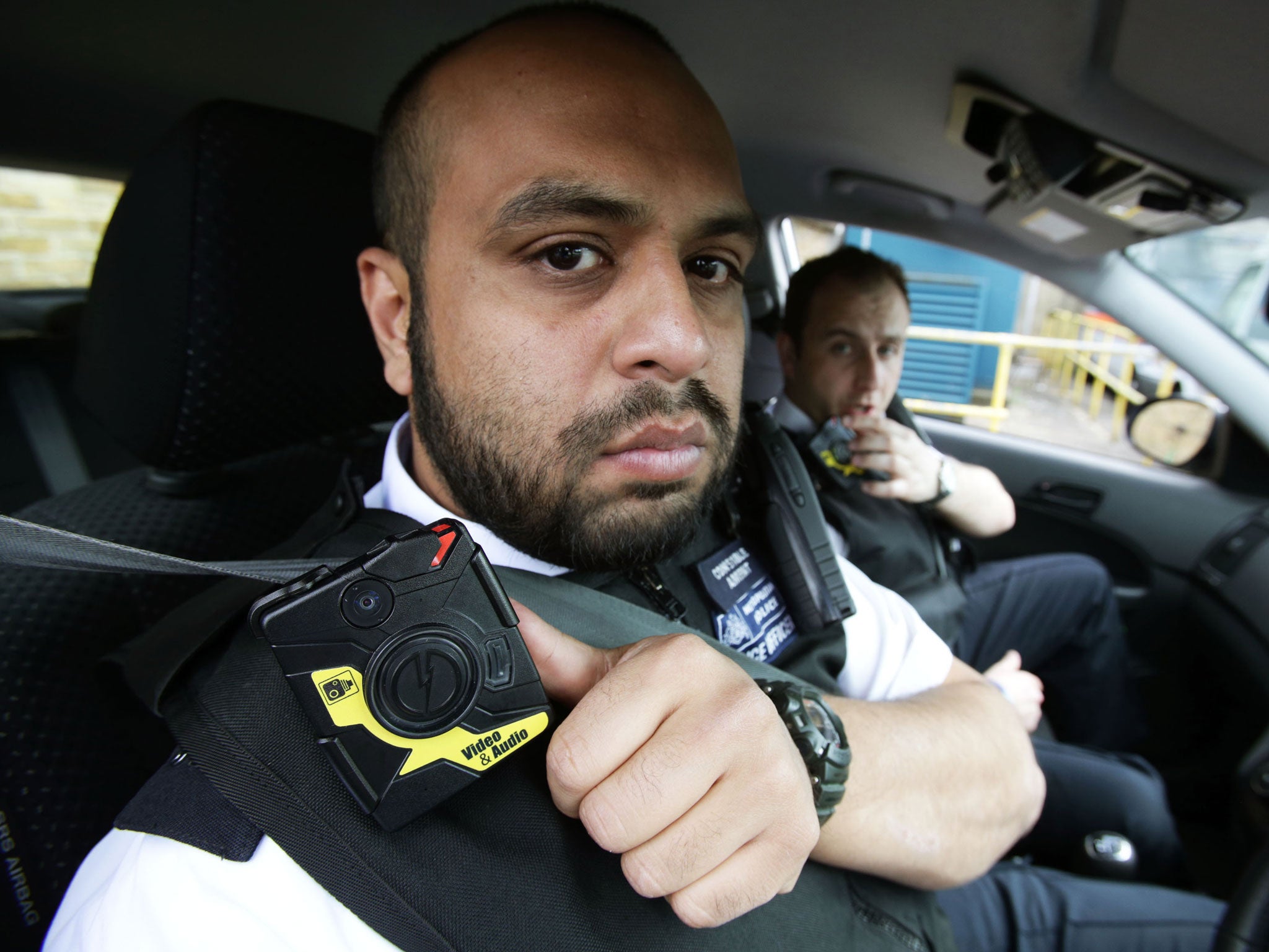 Two police officers wearing body cameras