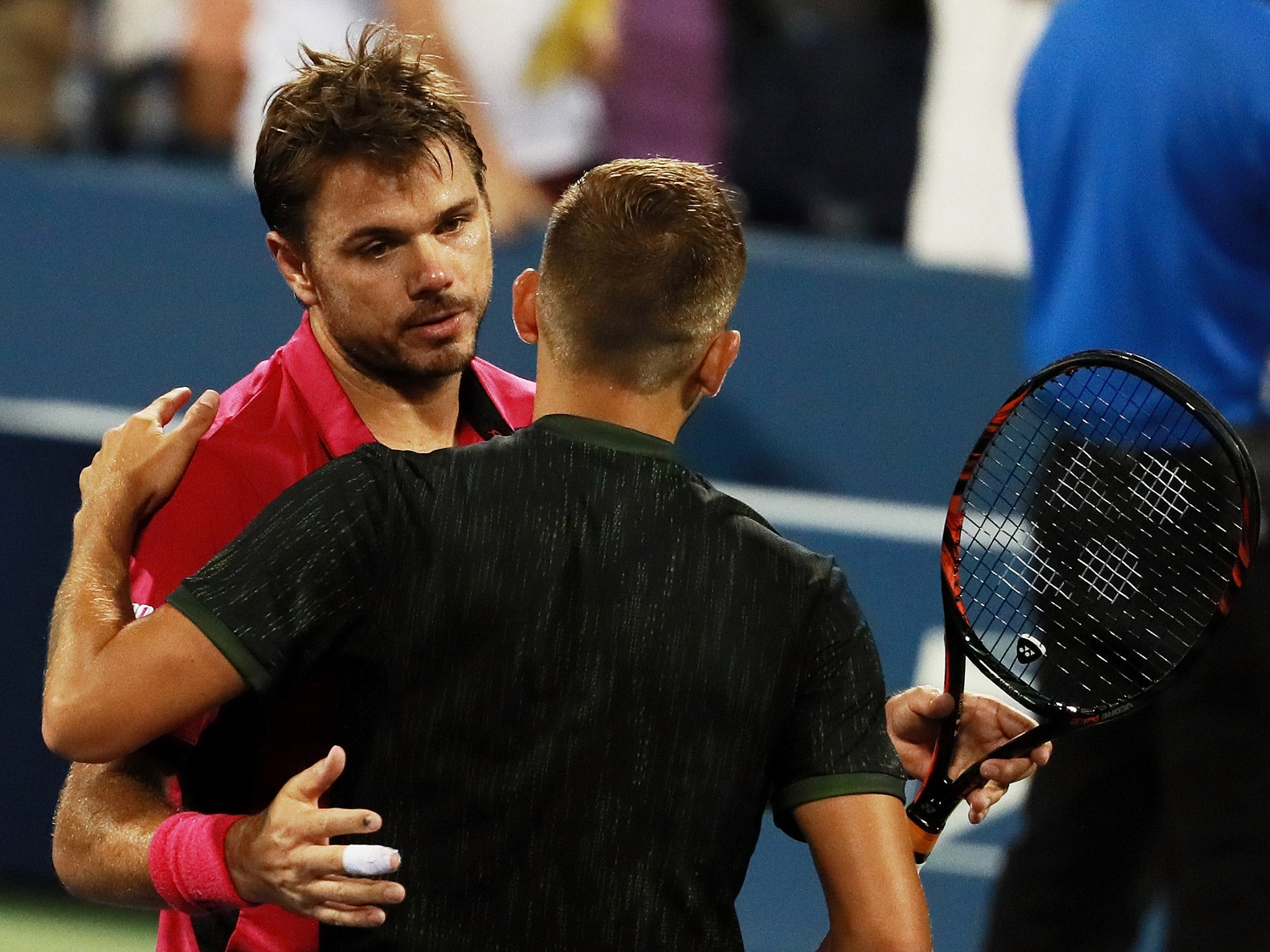 Stan Wawrinka embraces Dan Evans after their US Open third round match