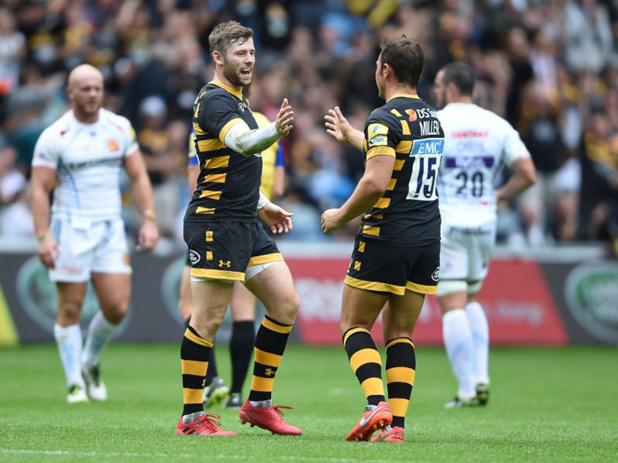 Elliot Daly and Rob Miller celebrate Wasps' 25-20 victory over Exeter