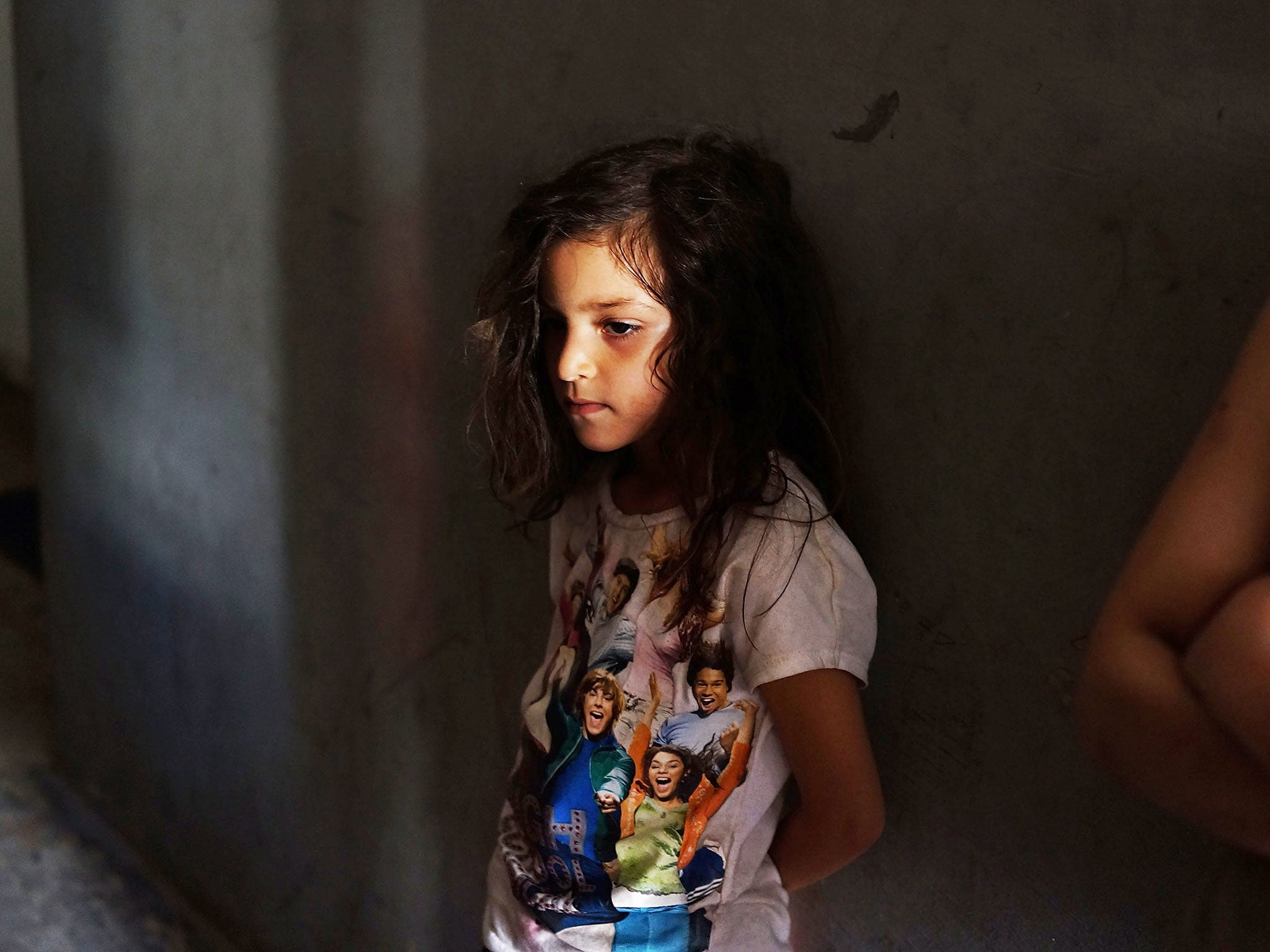 Lebanon, with a population of four million, is home to the highest per capita number of Syrian refugees in the world, many of whom – like this young girl – share overcrowded flats in Beirut (Spencer Platt/Getty)