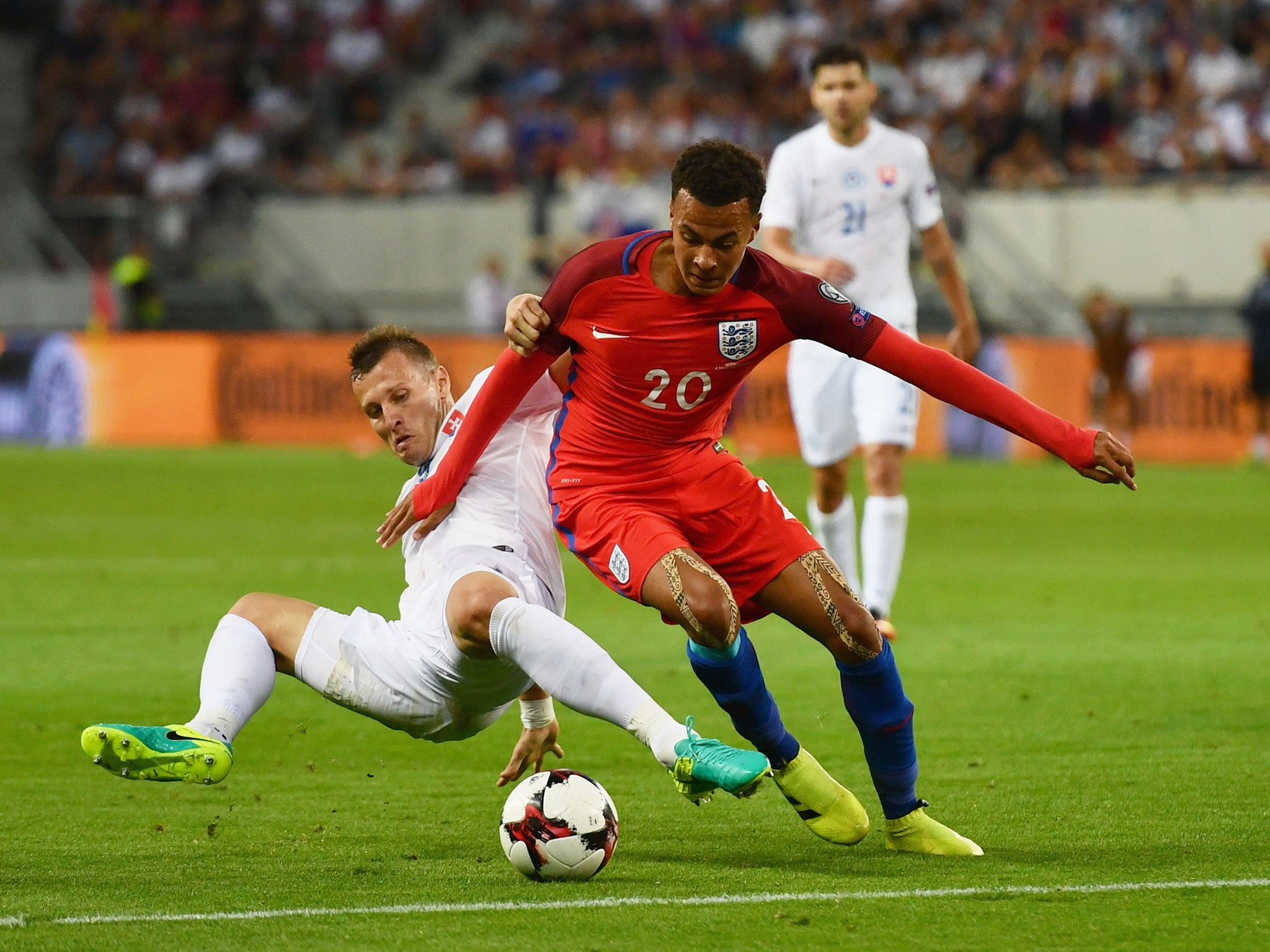 Dele Alli takes on the Slovakia defence