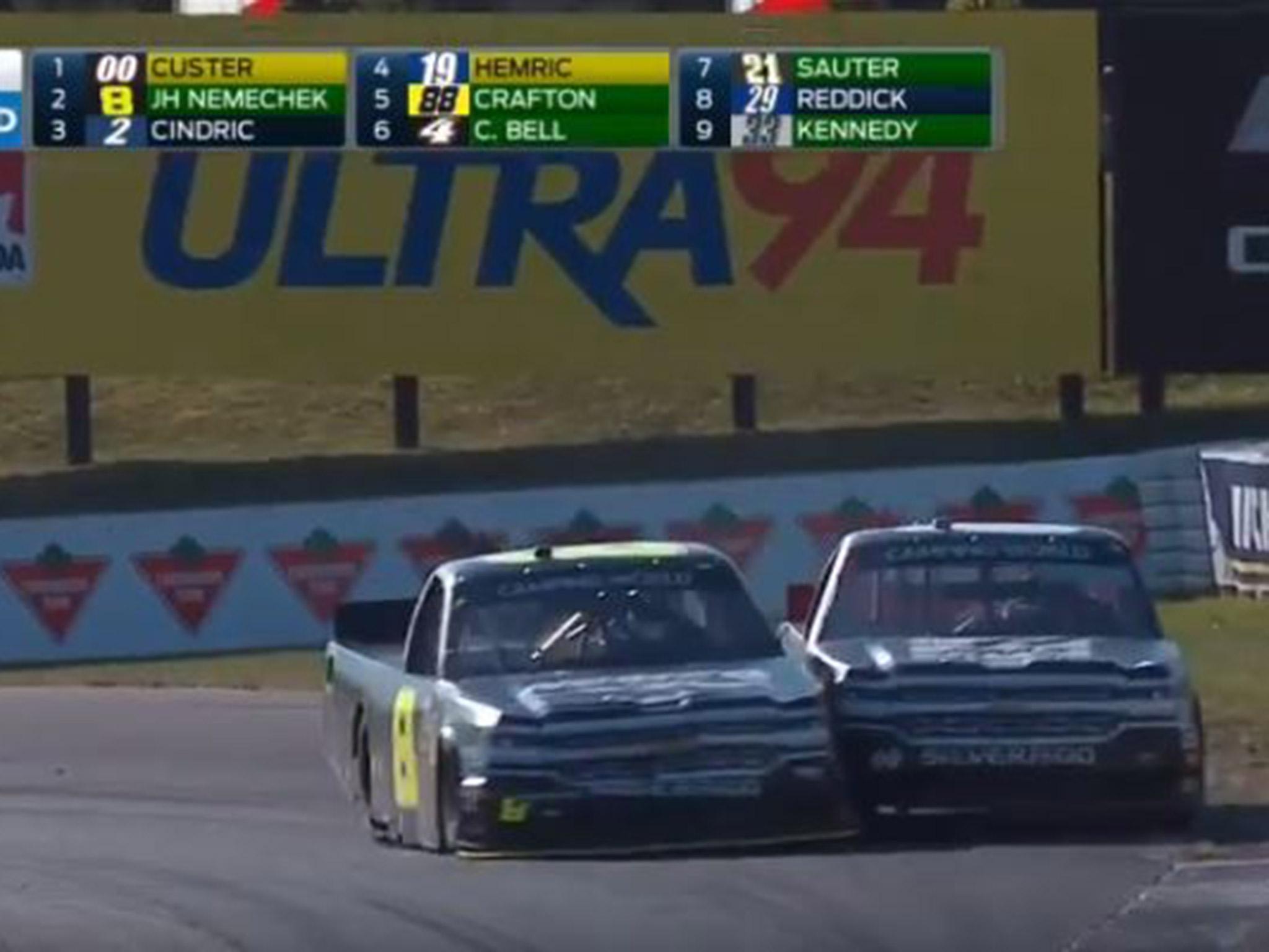 &#13;
Nemechek turns left to force Cluster off the road &#13;