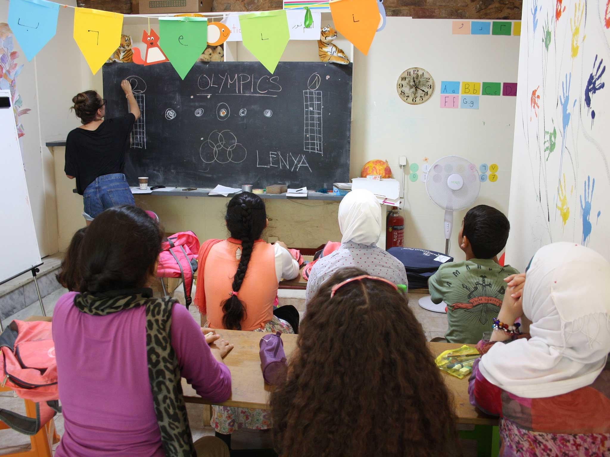 Morning classes are taught by two Syrian couples who were primary school teachers in their homeland (Refugee Education Chios )