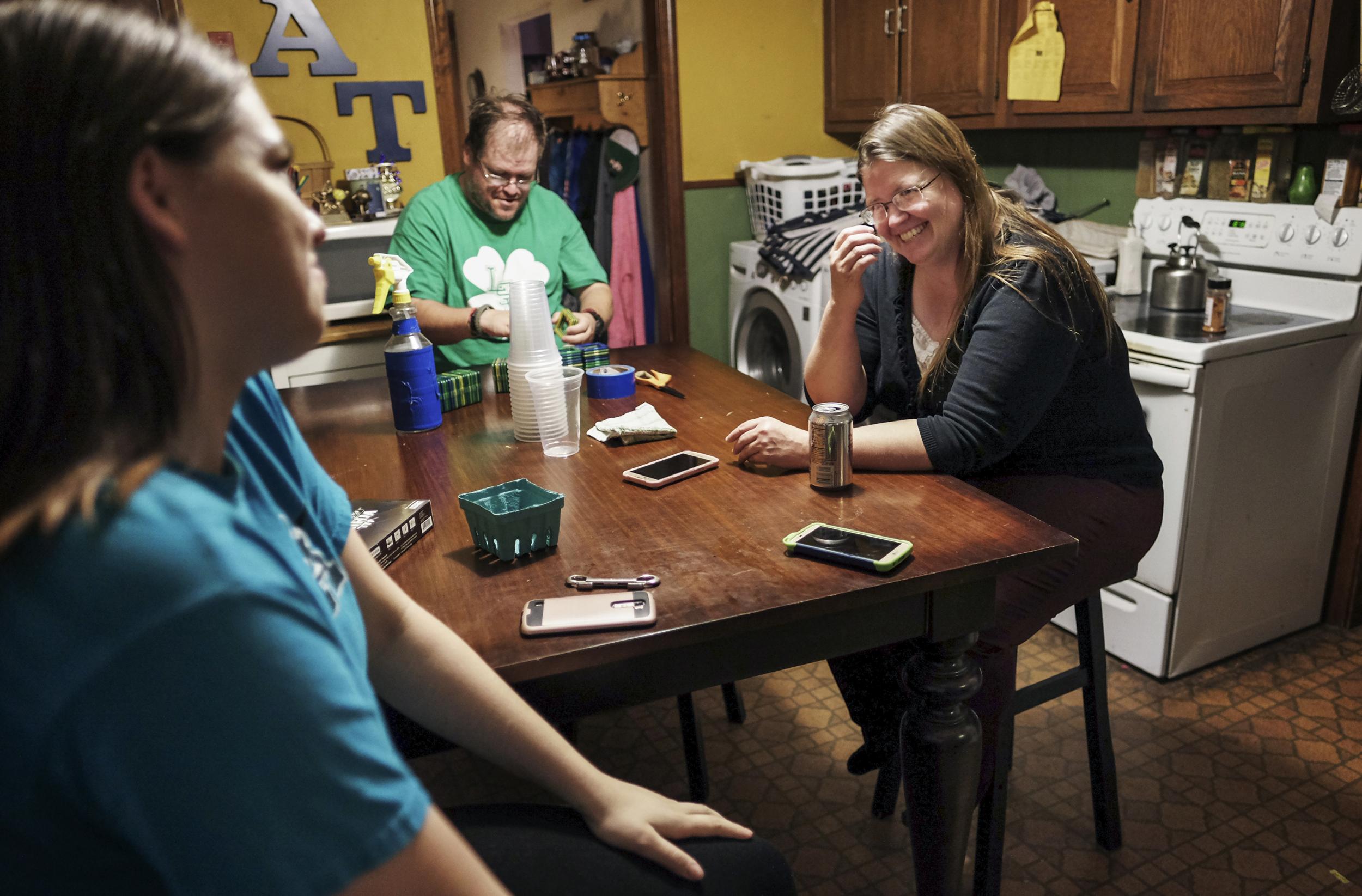 Maureen jokes with her mother, Elizabeth, and her uncle in the family's kitchen.