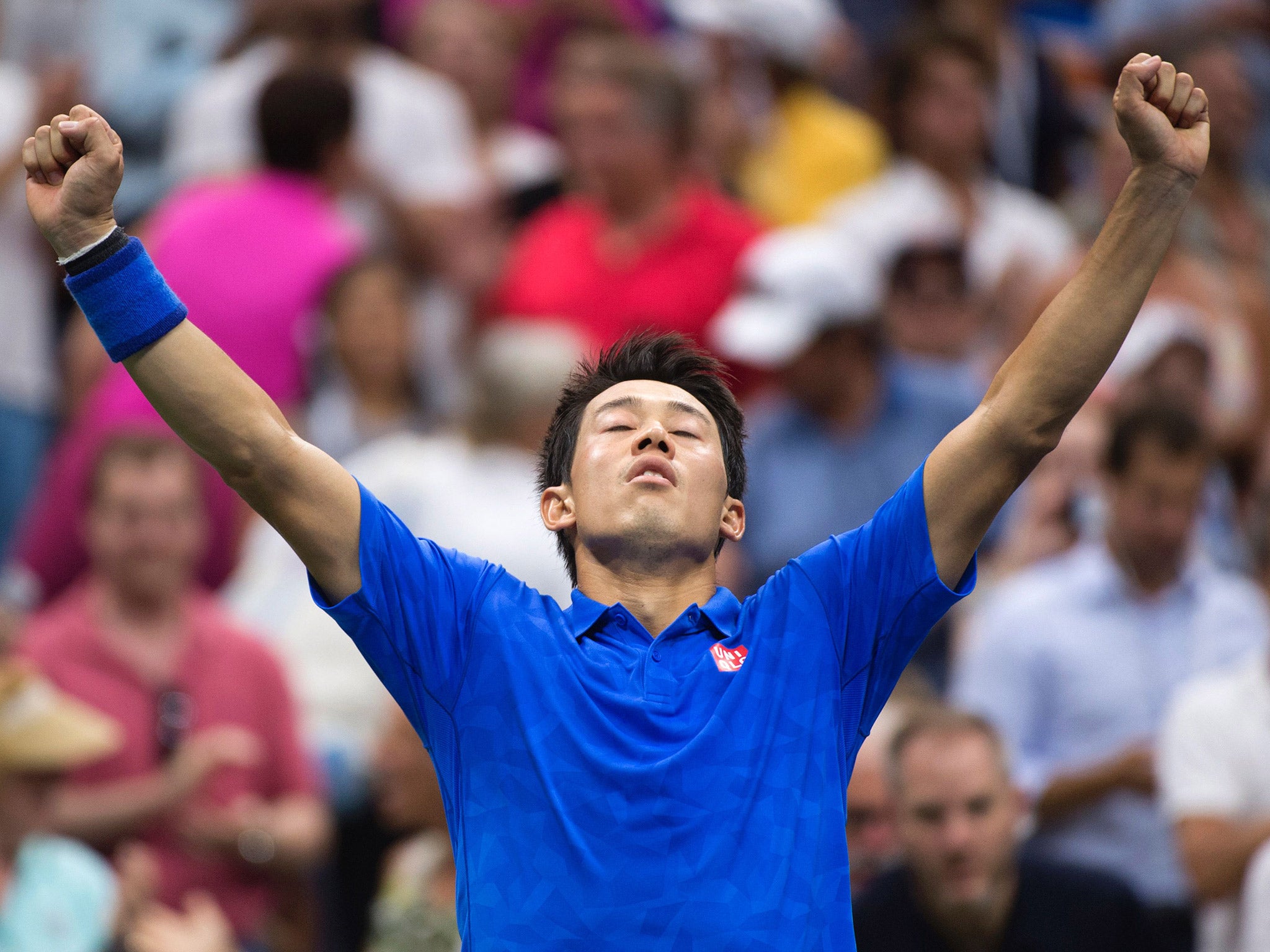 Kei Nishikori celebrates his victory over Andy Murray