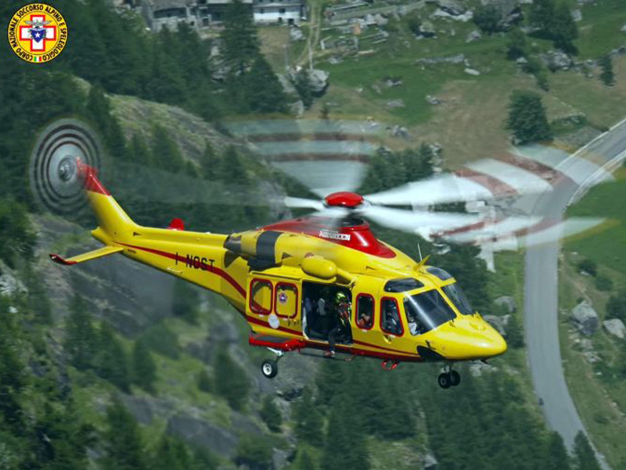 A helicopter of the Italian Alpine Rescue deployed in an evacuation of people stuck in cable cars at Mont Blanc mountain