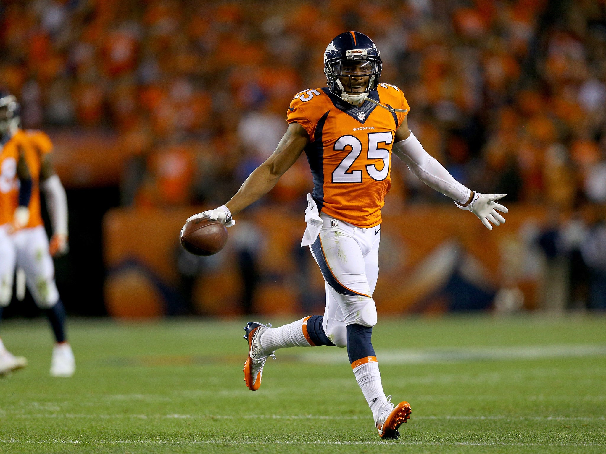 Chris Harris celebrates an interception