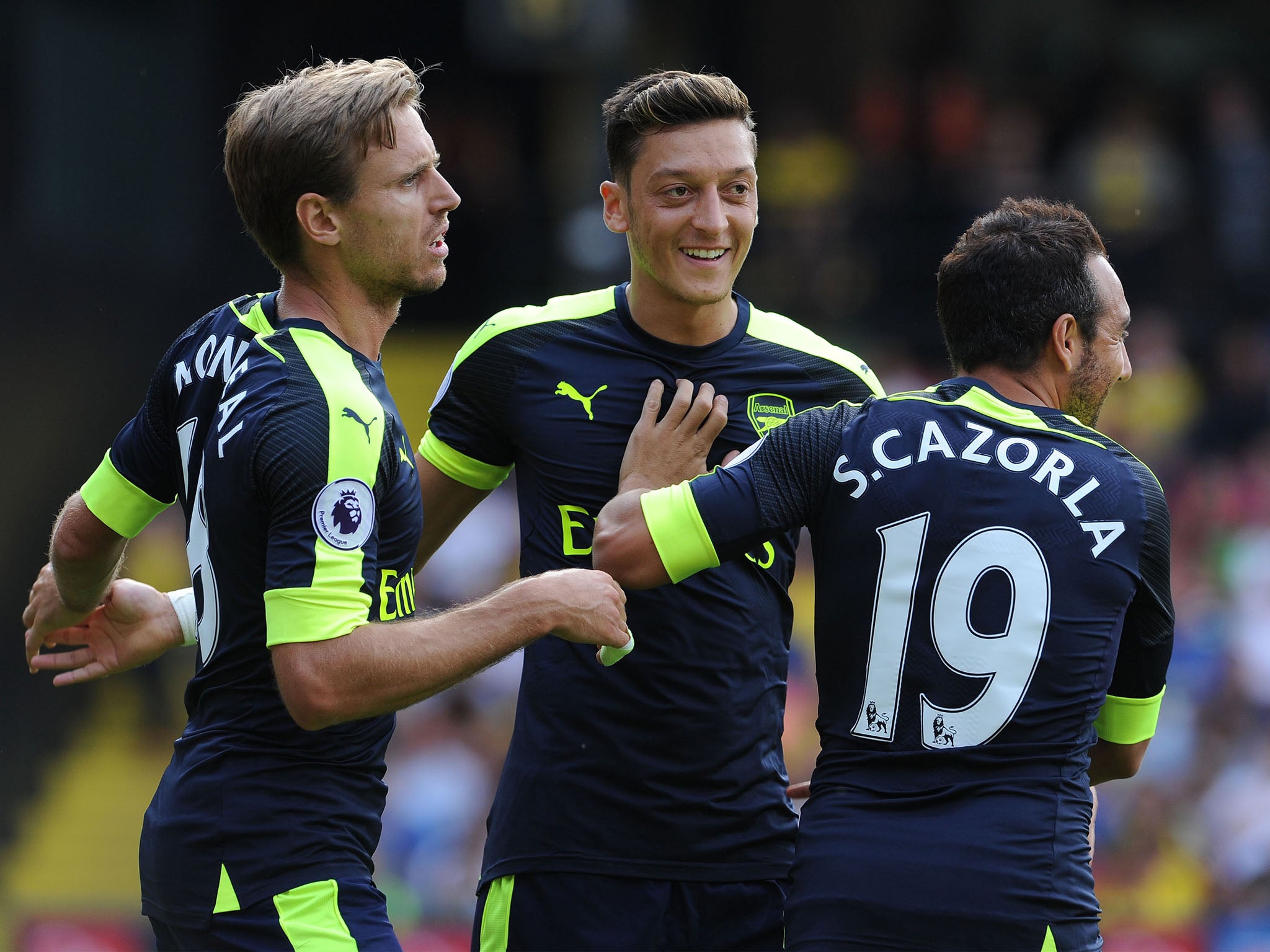 Arsenal celebrate scoring against Watford