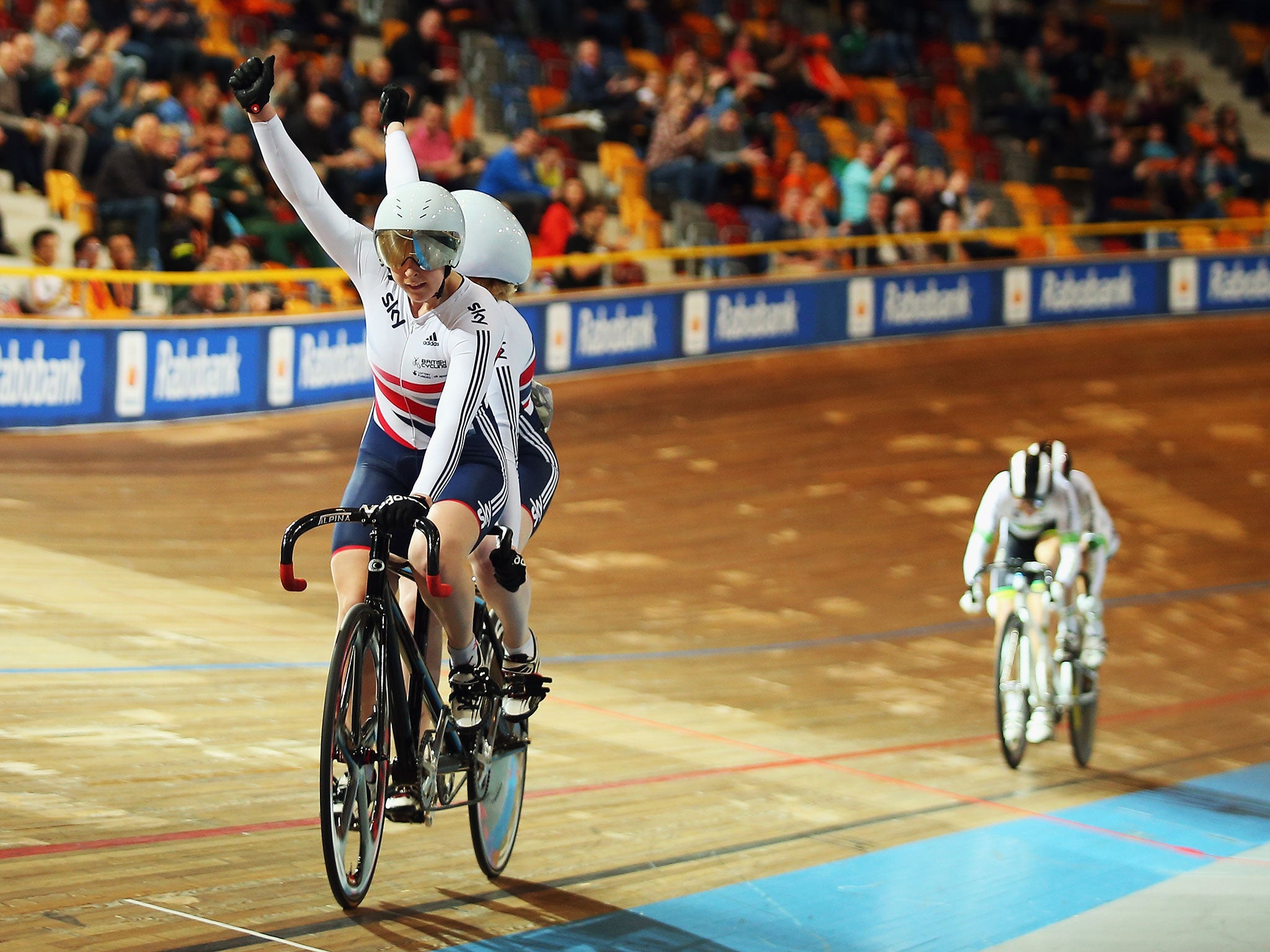 Sophie Thornhill and her tandem pilot Helen Scott celebrate their gold victory