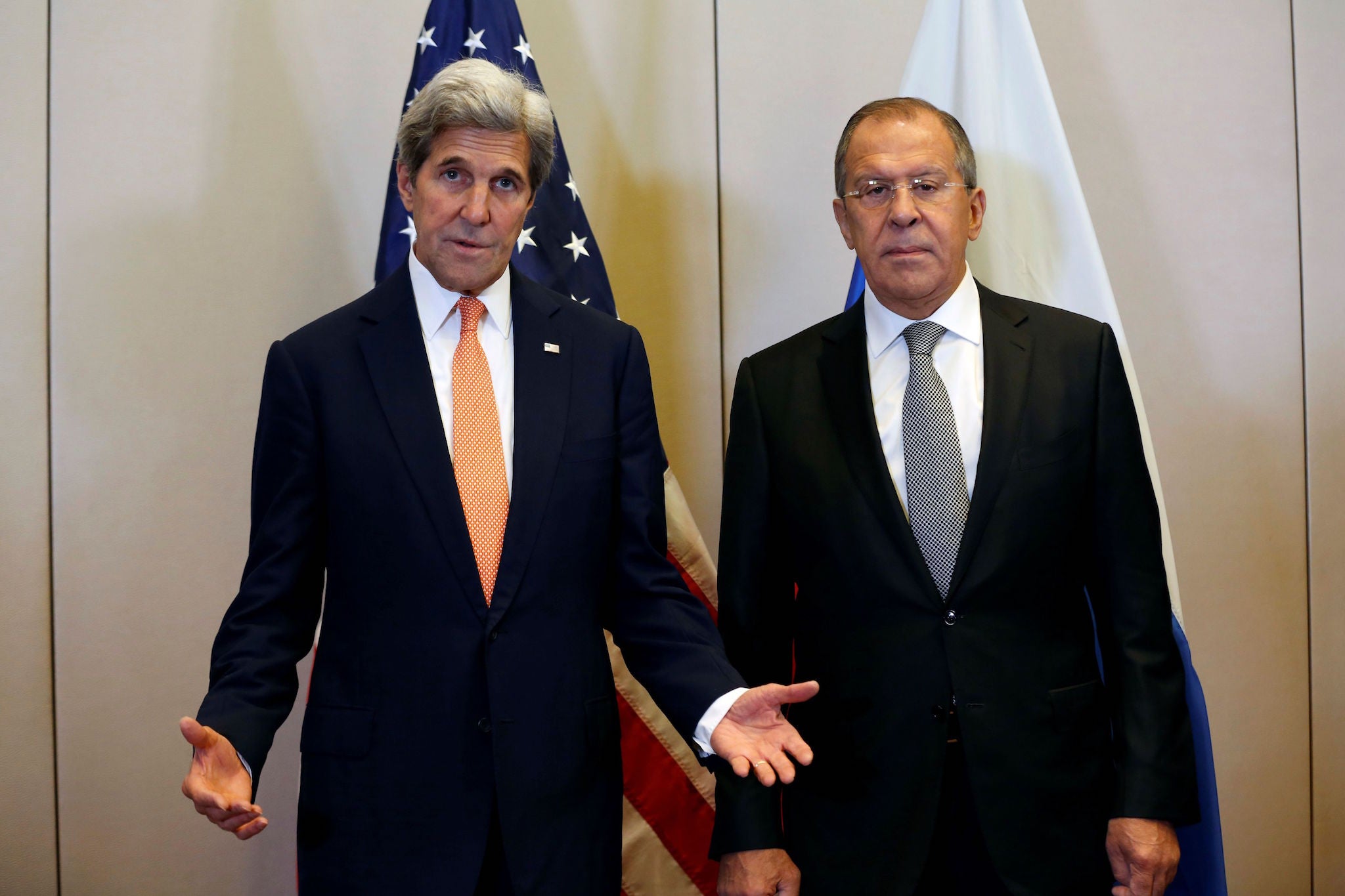 US Secretary of State John Kerry (L) gestures as he speaks while he arrives with Russian Minister for Foreign Affairs Sergei Lavrov (R) prior to a meeting to discuss the Syrian crisis on September 9, 2016, in Geneva