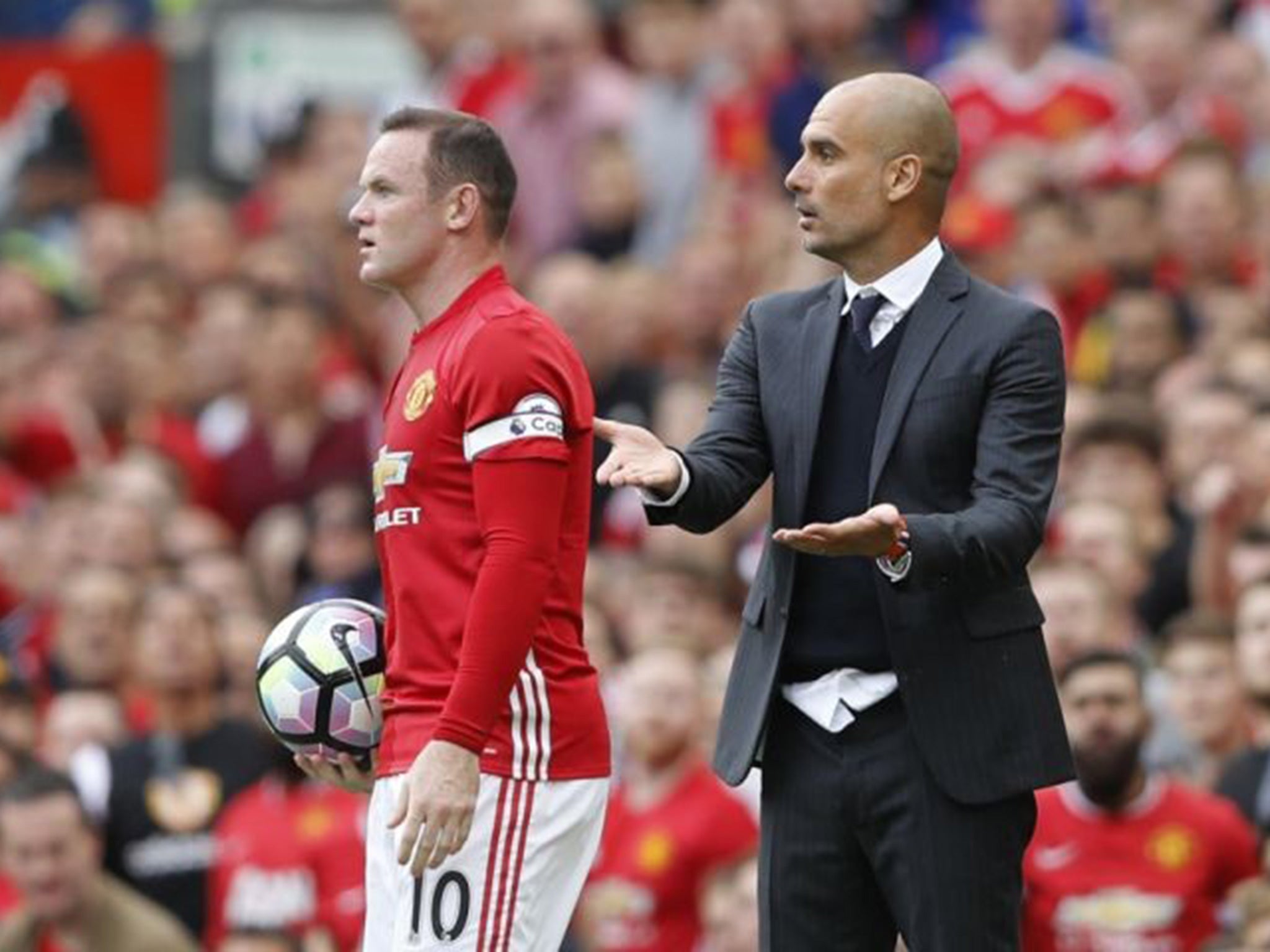 Rooney and Guardiola on the touchline at Old Trafford