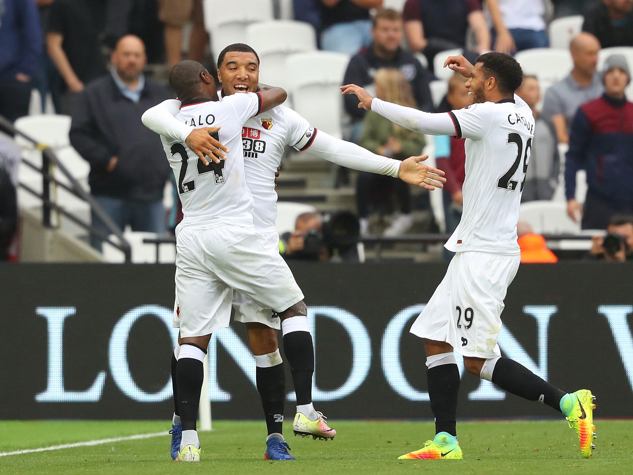 Troy Deeney celebrates with fellow goalscorer Odion Ighalo