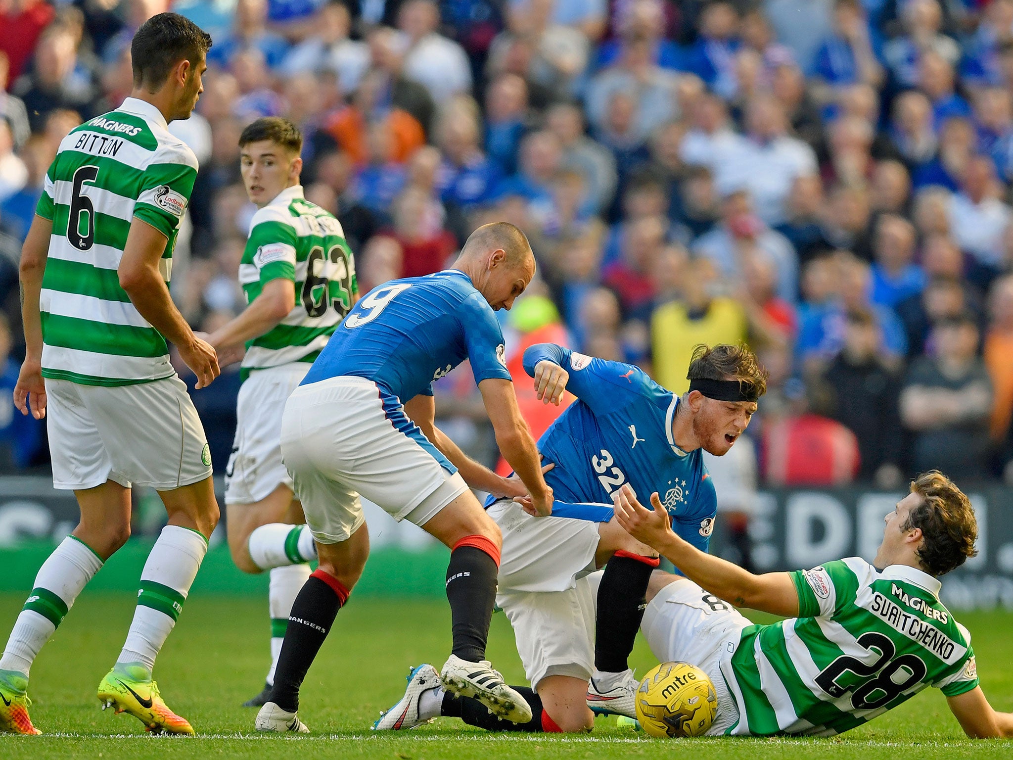 Erik Sviatchenko of Celtic reacts against Joe Garner of Rangers during the Old Firm derby