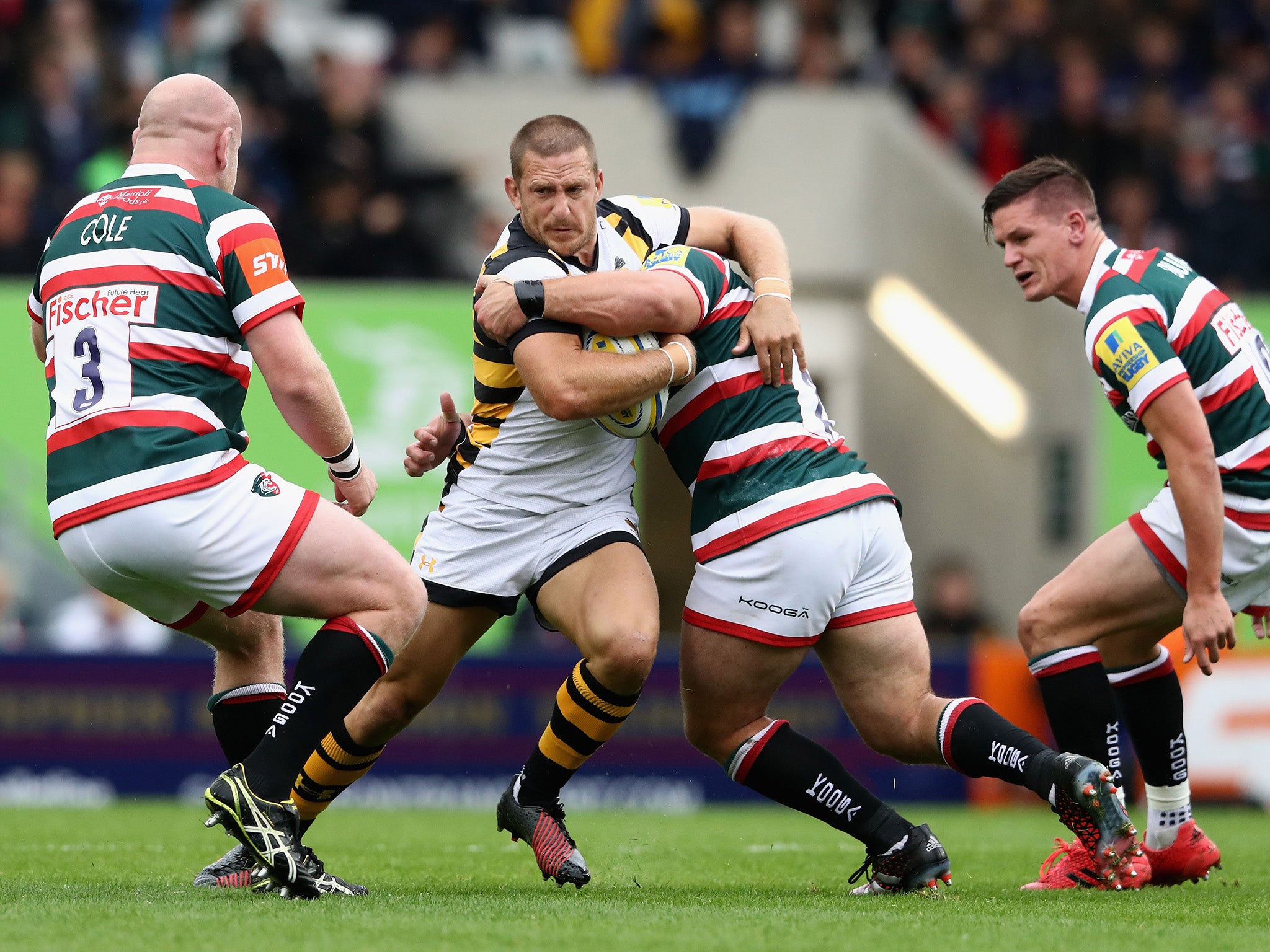 Jimmy Gopperth wrestles through the tackle