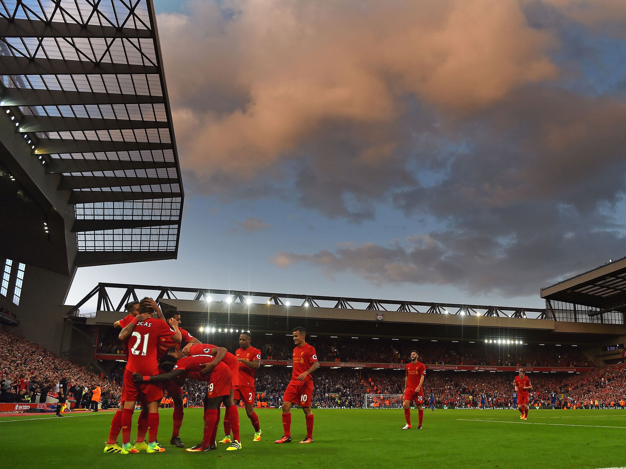 Liverpool players celebrate with Firmino after he scored the side's fourth goal