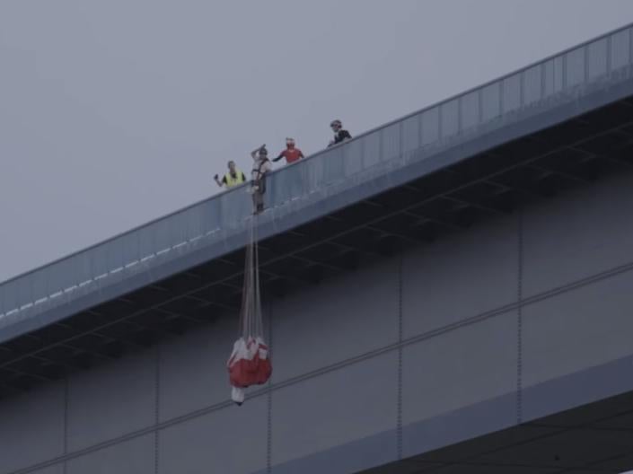 Professional jumper Chris McDougall from Australia spotted the man had not put on his leg straps moments before he was about to jump